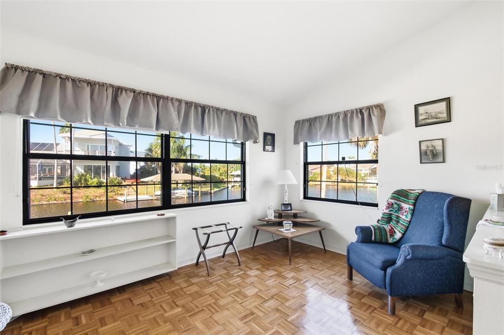 24 Chippeway Court Palm Coast, FL 32137 - Photo 34 of 69 a living room with furniture and a large window