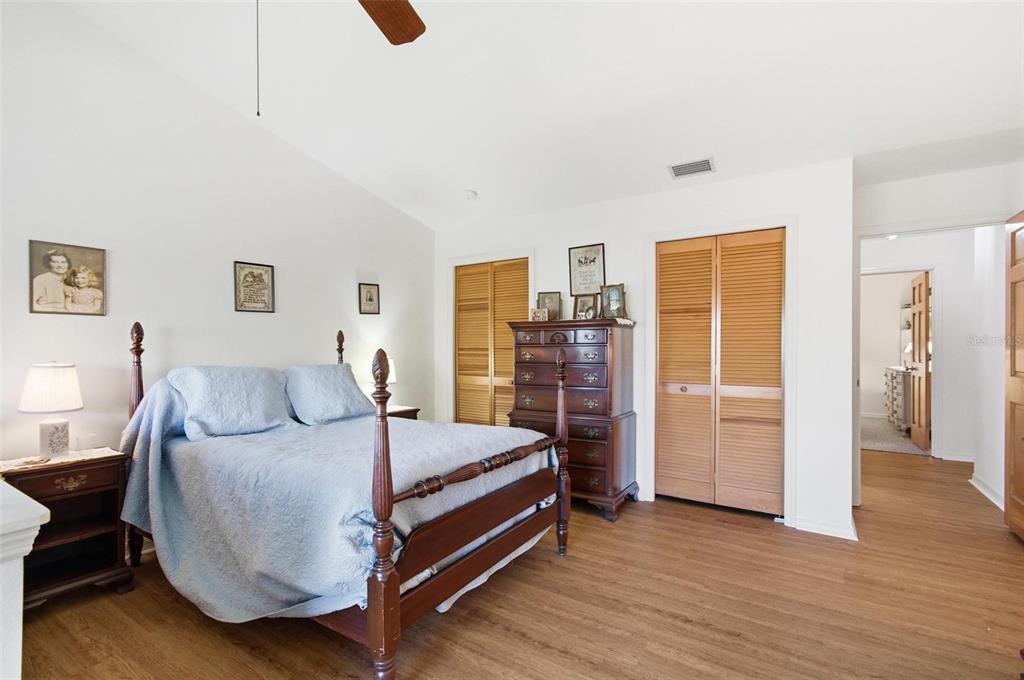 24 Chippeway Court Palm Coast, FL 32137 - Photo 38 of 69 a bedroom with a bed and wooden floor