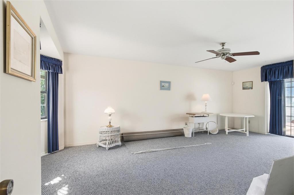 24 Chippeway Court Palm Coast, FL 32137 - Photo 41 of 69 a living room with furniture and a ceiling fan