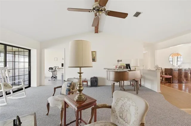 a kitchen with stainless steel appliances a refrigerator a stove a sink dishwasher and white cabinets with wooden floor