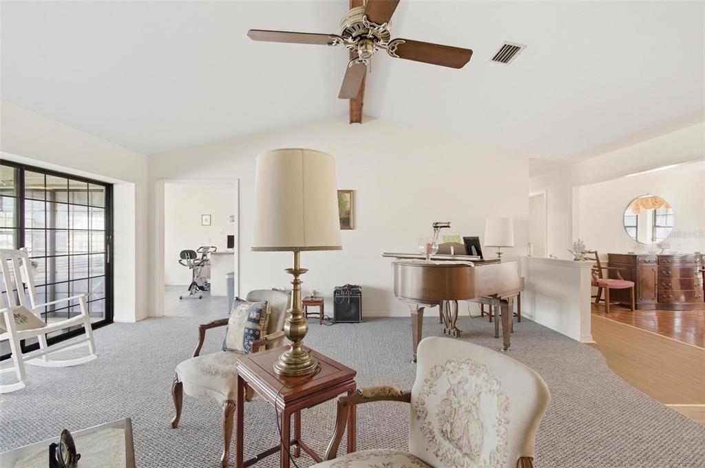 24 Chippeway Court Palm Coast, FL 32137 - Photo 9 of 69 a living room with furniture and a window