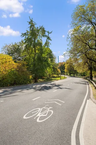 a view of a road with a building in the background