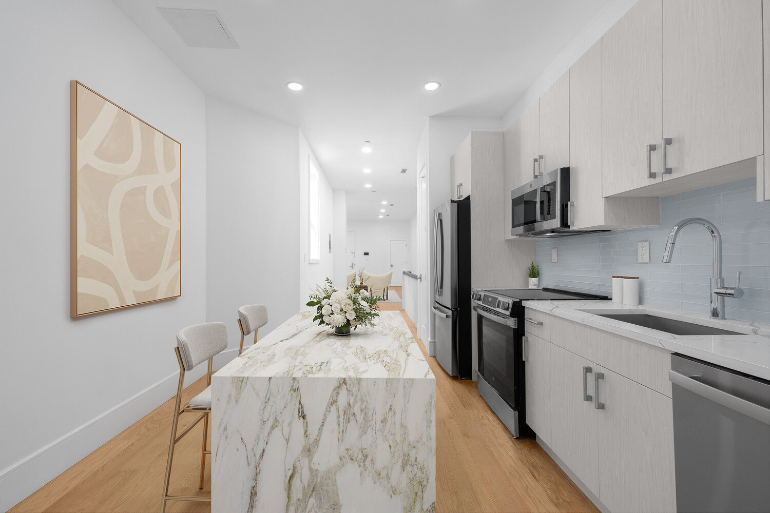 8 West 87th Street, Unit 1B Manhattan, NY 10024 - Photo 8 of 11 a kitchen with a sink stove and refrigerator
