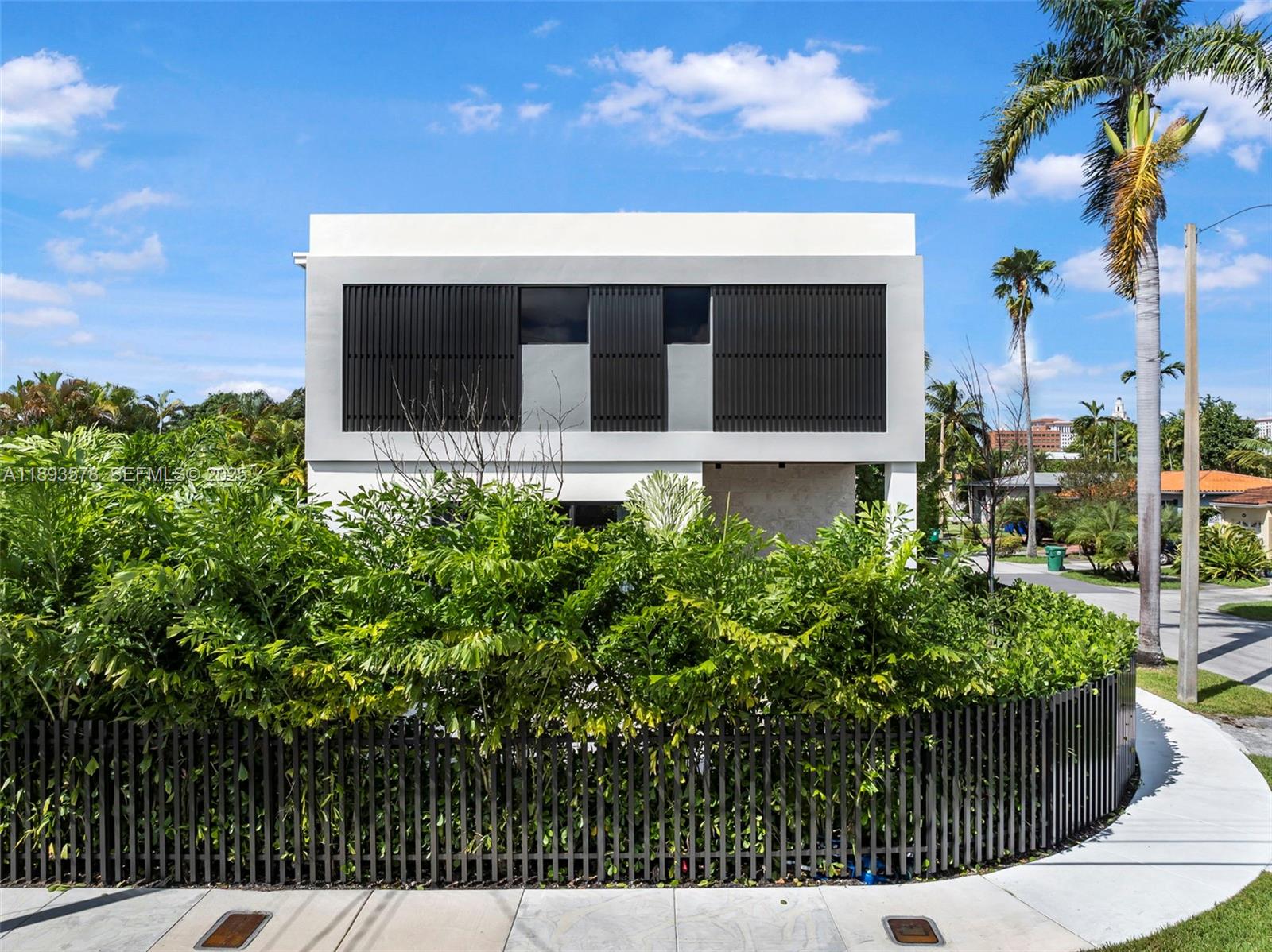 3300 Southwest 27th Terrace, Unit 3300 Miami, FL 33133 - Photo 2 of 76 a picture of a house with a garden