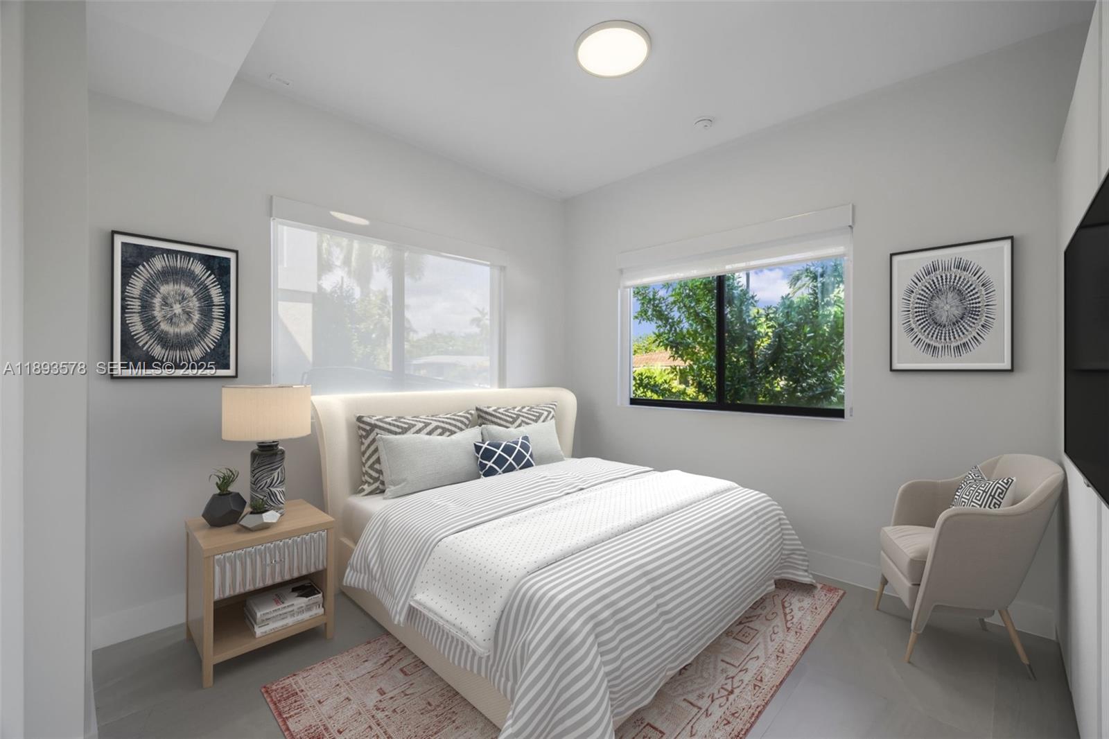 3300 Southwest 27th Terrace, Unit 3300 Miami, FL 33133 - Photo 25 of 76 a bedroom with a bed and a painting on the wall