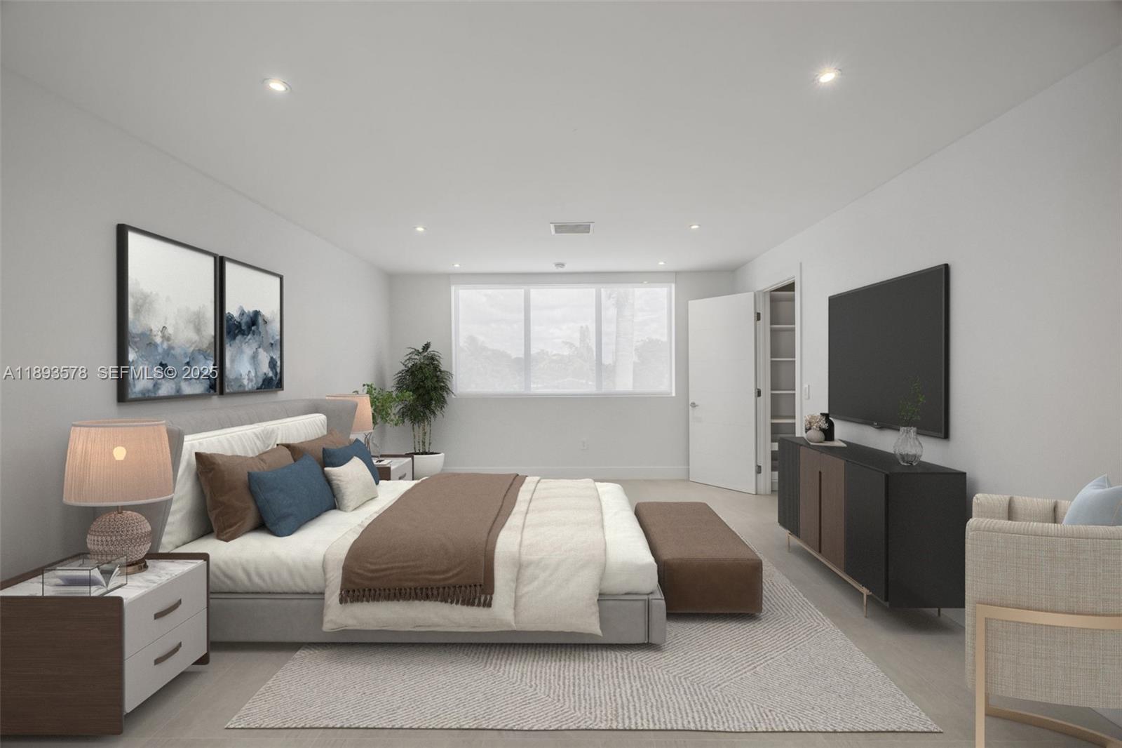 3300 Southwest 27th Terrace, Unit 3300 Miami, FL 33133 - Photo 32 of 76 a bedroom with a large bed and a flat screen tv