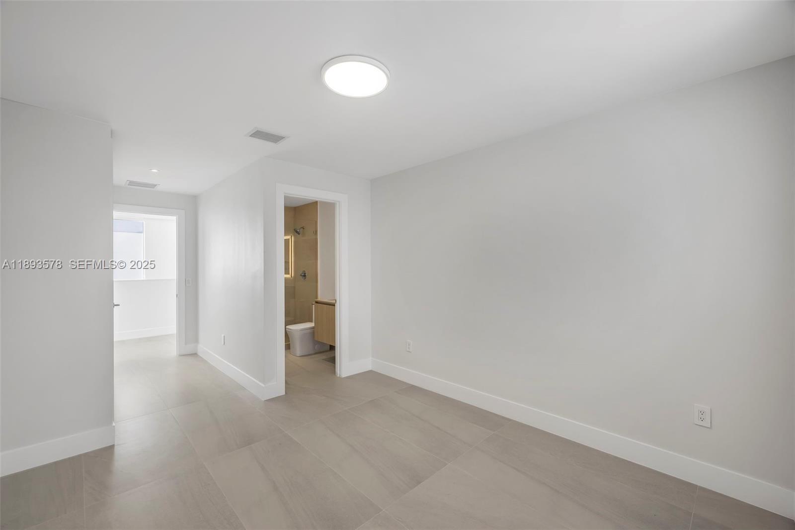 3300 Southwest 27th Terrace, Unit 3300 Miami, FL 33133 - Photo 44 of 76 a view of an empty room and closet area