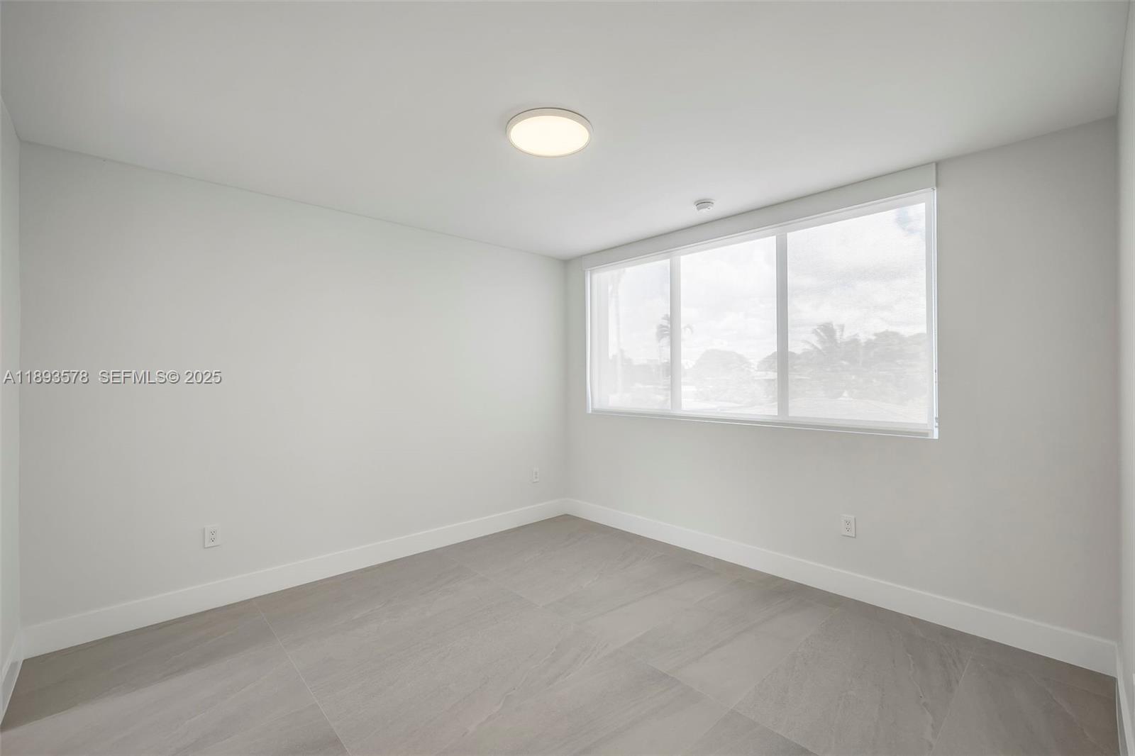 3300 Southwest 27th Terrace, Unit 3300 Miami, FL 33133 - Photo 48 of 76 an empty room with a window