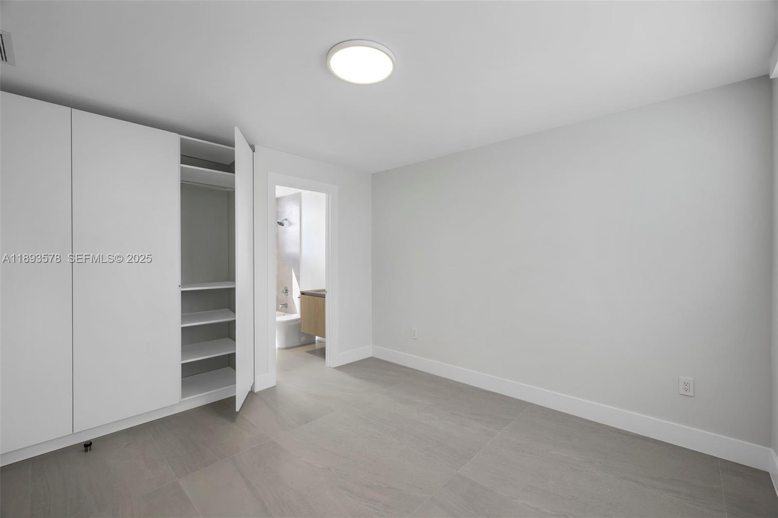 3300 Southwest 27th Terrace, Unit 3300 Miami, FL 33133 - Photo 49 of 76 a view of an empty room and a window