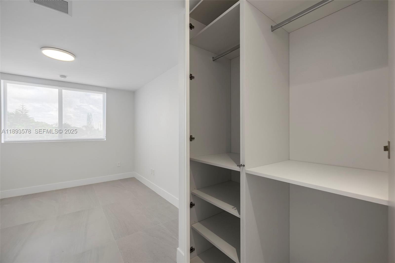 3300 Southwest 27th Terrace, Unit 3300 Miami, FL 33133 - Photo 51 of 76 a view of an empty walk in closet