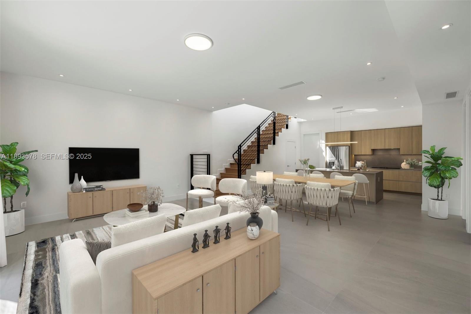 3300 Southwest 27th Terrace, Unit 3300 Miami, FL 33133 - Photo 7 of 76 a living room with furniture and a flat screen tv