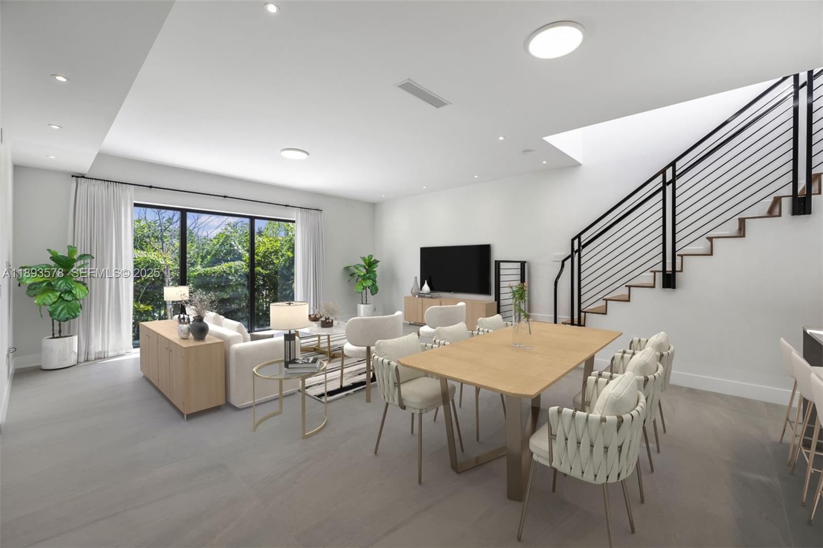 3300 Southwest 27th Terrace, Unit 3300 Miami, FL 33133 - Photo 9 of 76 a living room with furniture and a flat screen tv