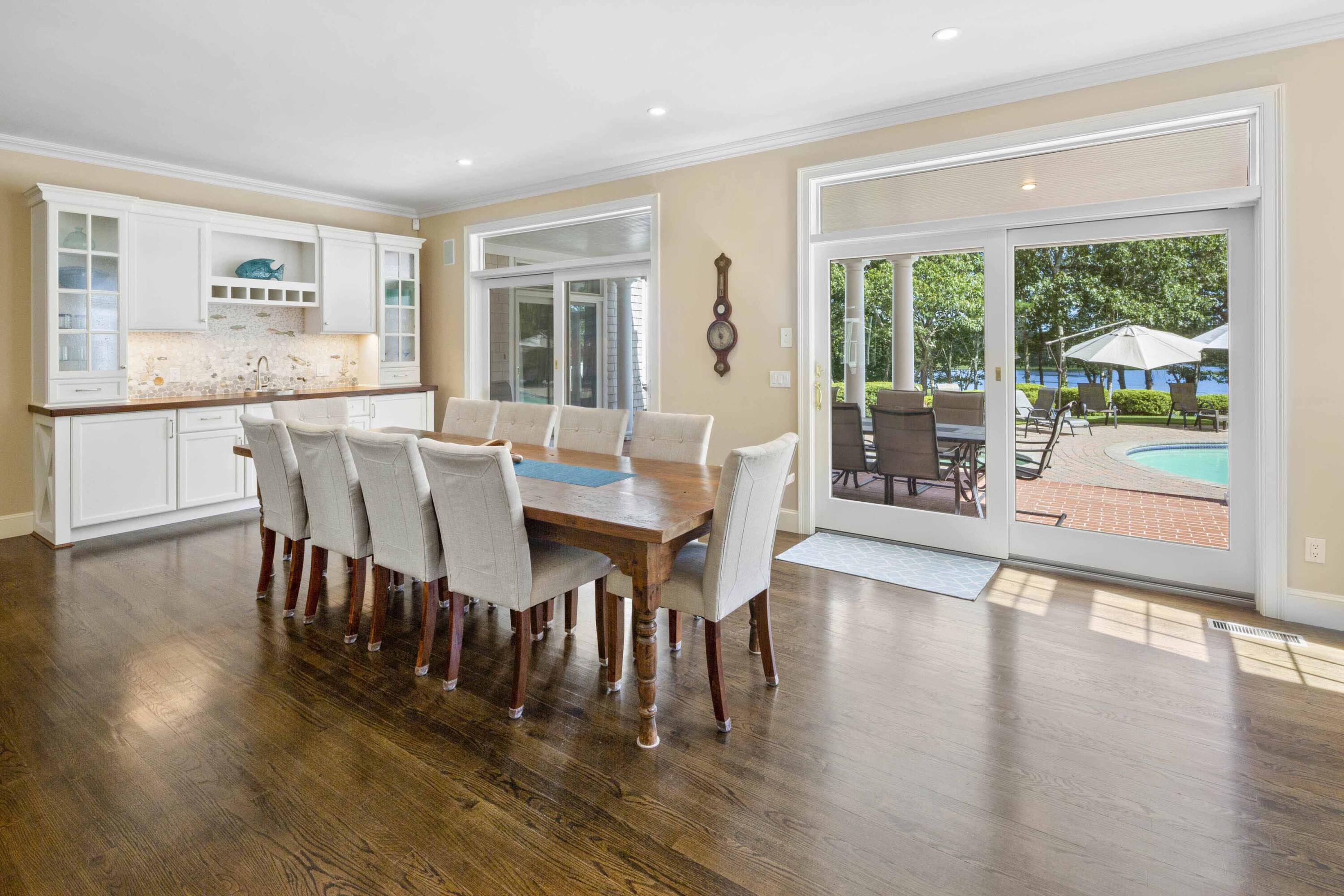 375 Baxter Neck Road Marstons Mills, MA 02648 - Photo 18 of 62 a view of a dining room with furniture window and wooden floor