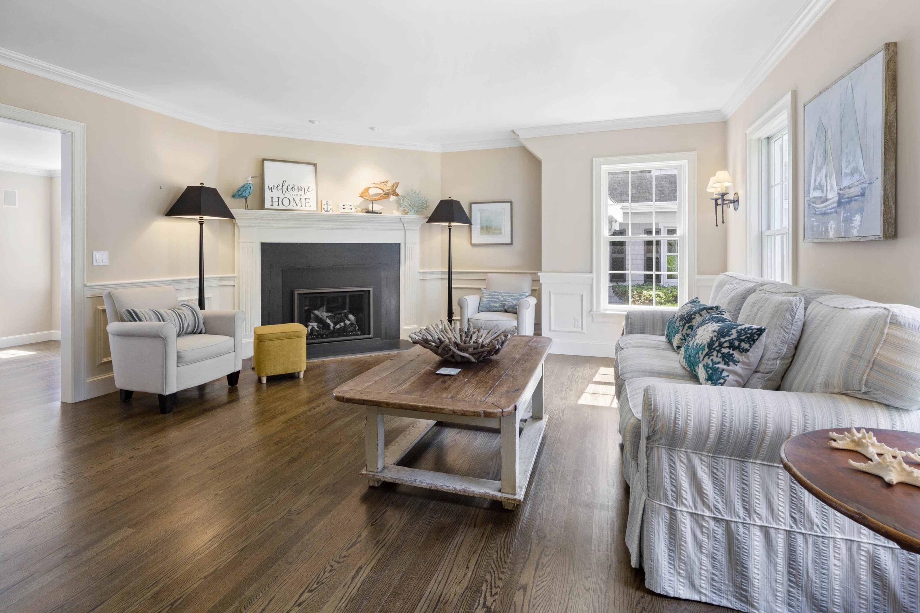 375 Baxter Neck Road Marstons Mills, MA 02648 - Photo 21 of 62 a living room with furniture and a fireplace