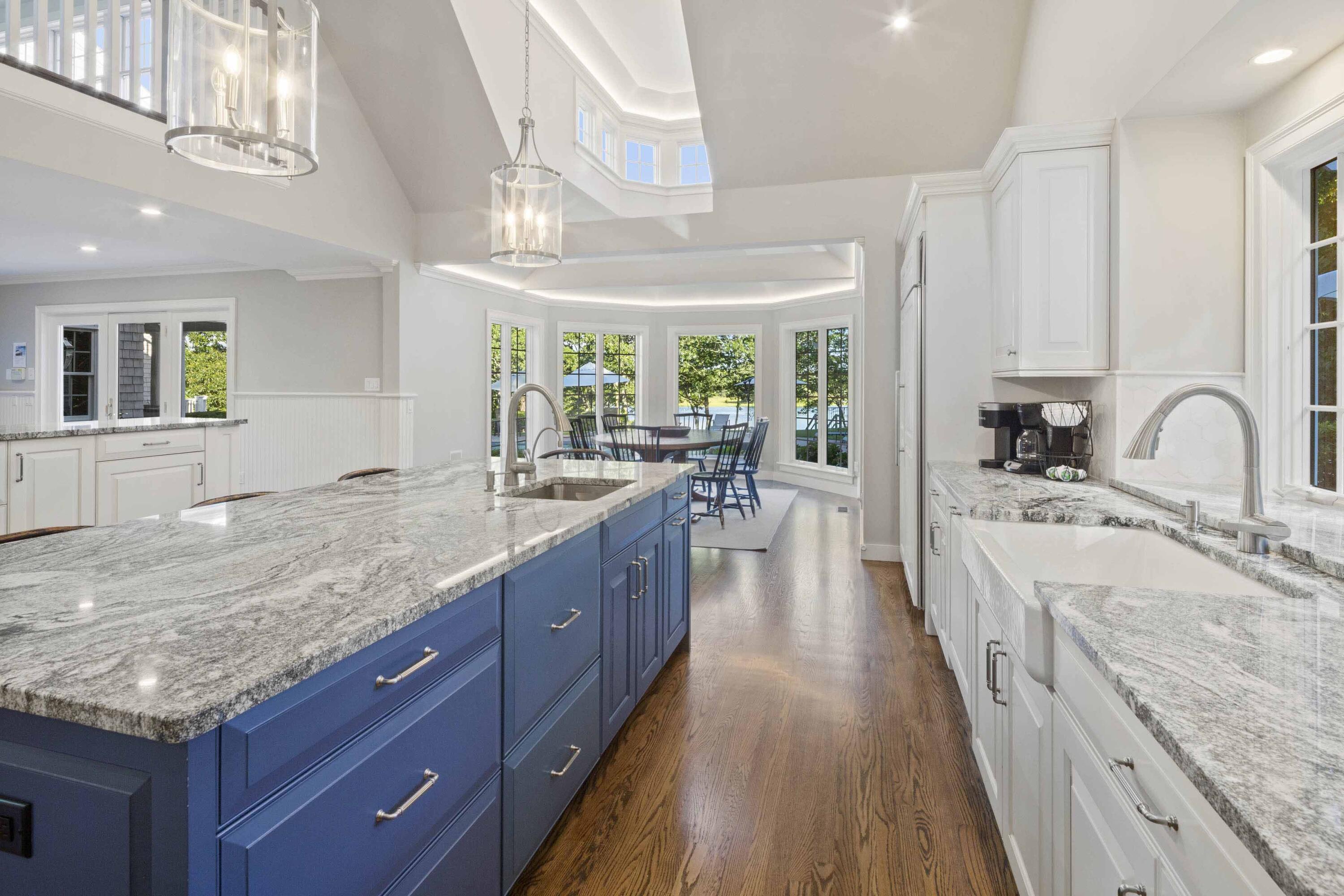 375 Baxter Neck Road Marstons Mills, MA 02648 - Photo 30 of 62 a large kitchen with kitchen island granite countertop a large window a sink and stainless steel appliances