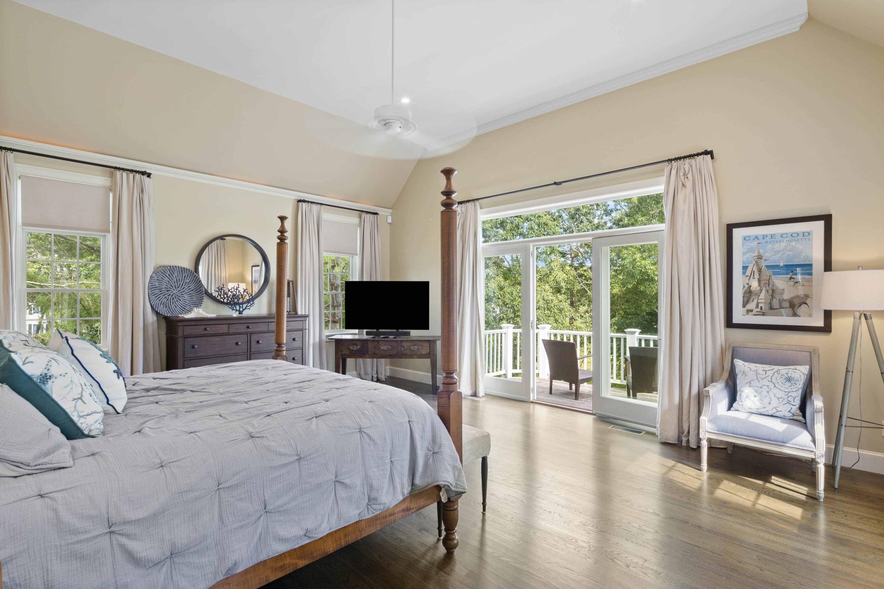 375 Baxter Neck Road Marstons Mills, MA 02648 - Photo 32 of 62 a bedroom with a bed a window and a flat screen tv