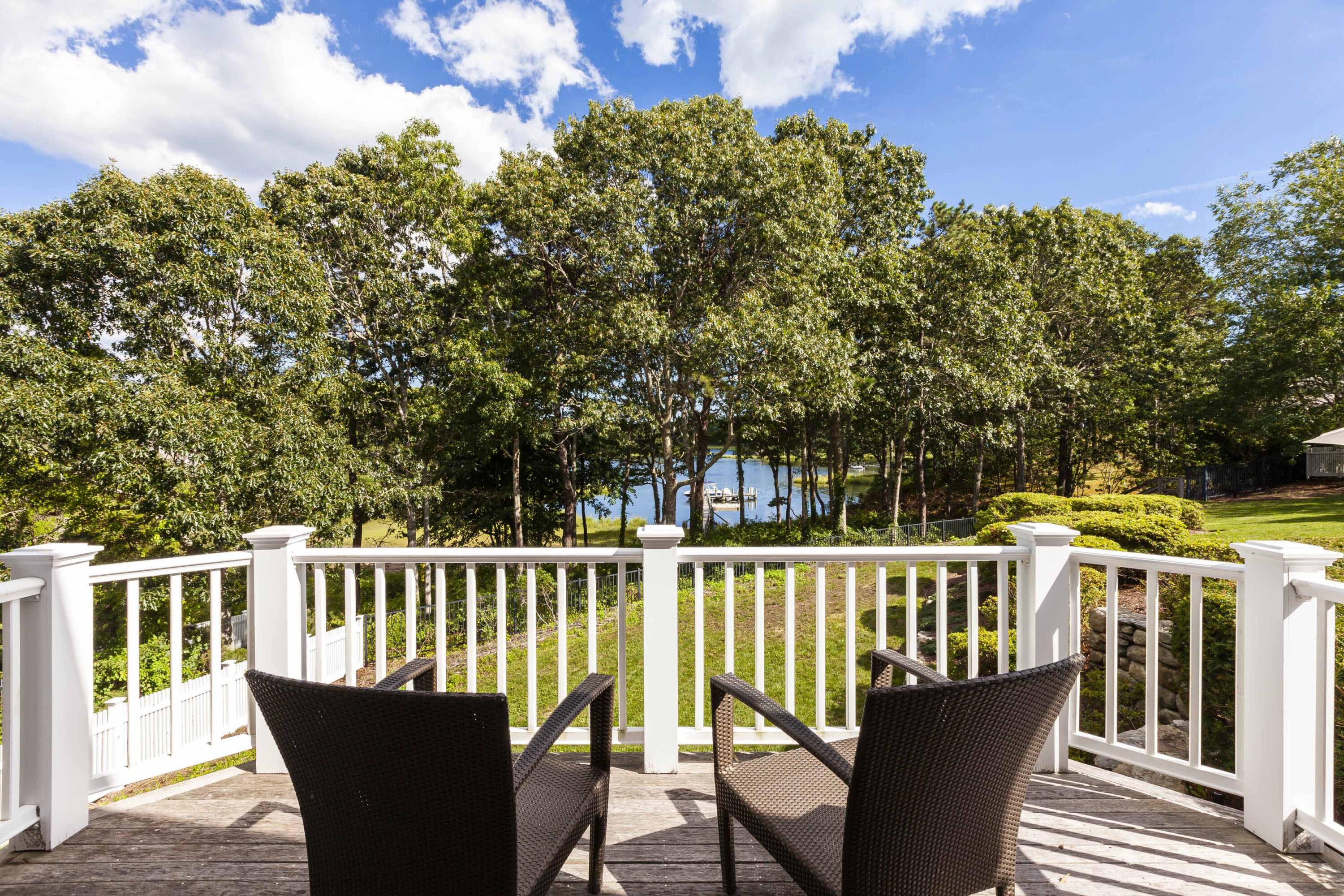 375 Baxter Neck Road Marstons Mills, MA 02648 - Photo 35 of 62 a view of a chair and table on the deck