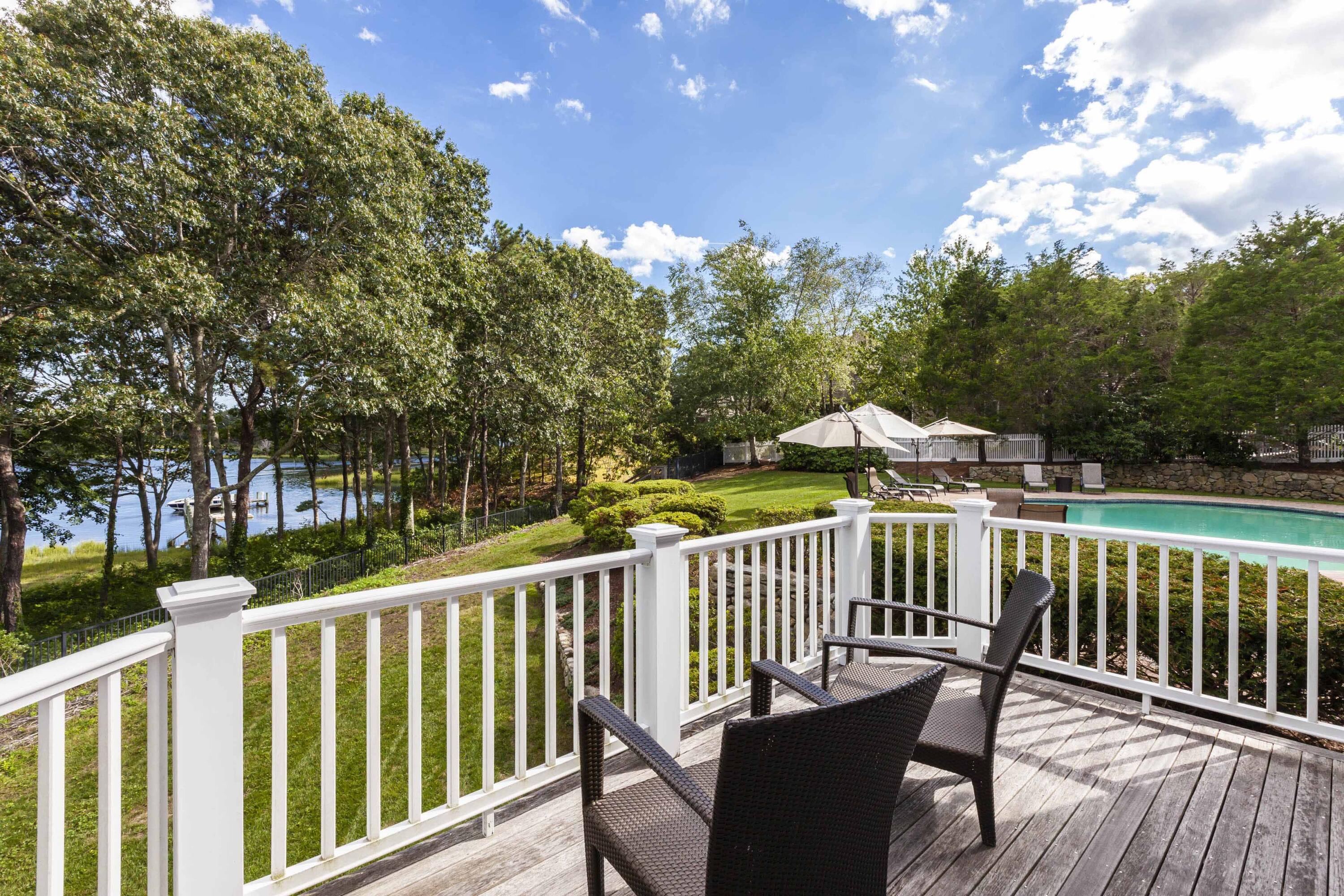 375 Baxter Neck Road Marstons Mills, MA 02648 - Photo 36 of 62 a view of a two chairs in the deck