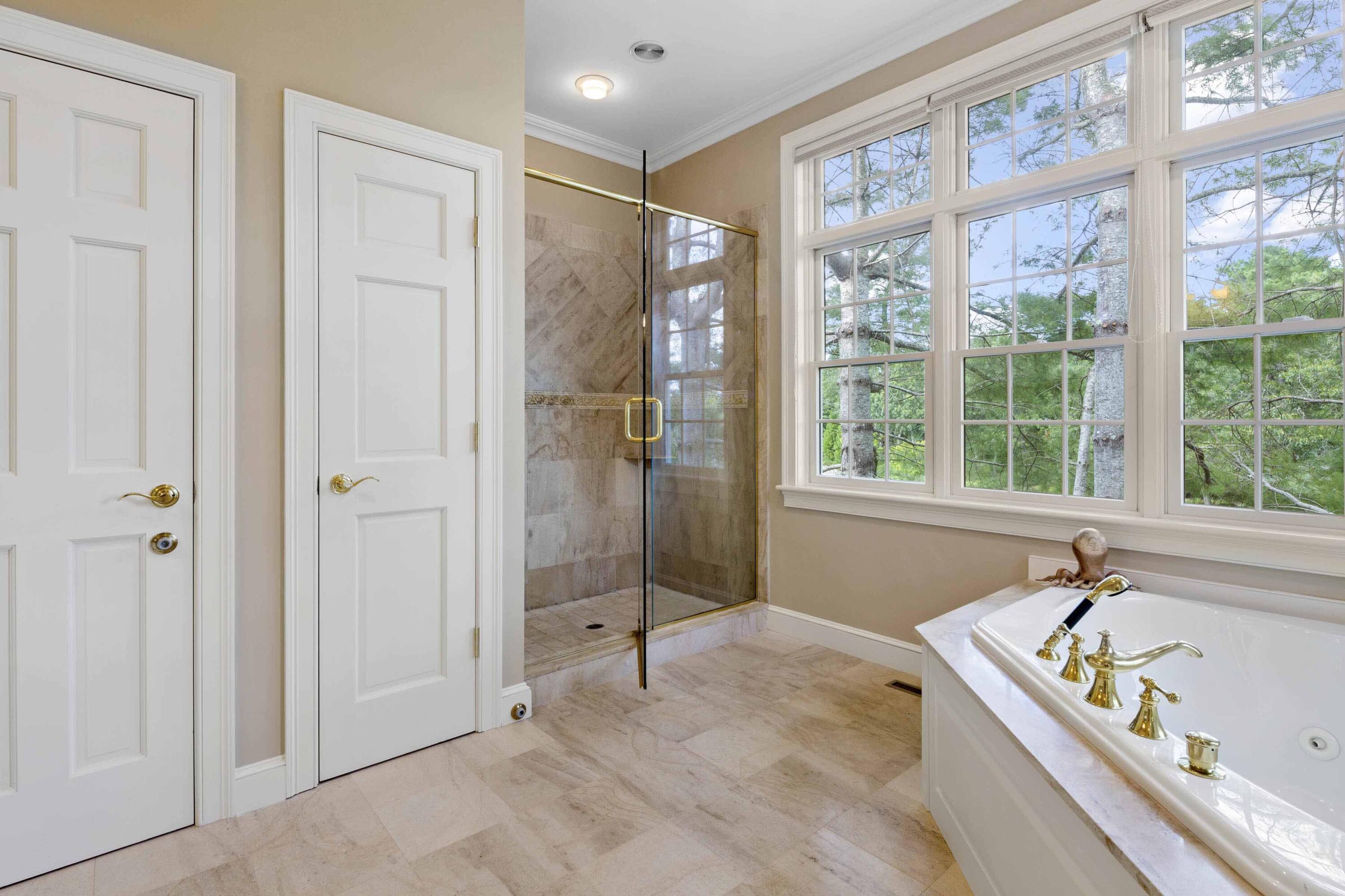 375 Baxter Neck Road Marstons Mills, MA 02648 - Photo 37 of 62 a bathroom with a tub and a sink