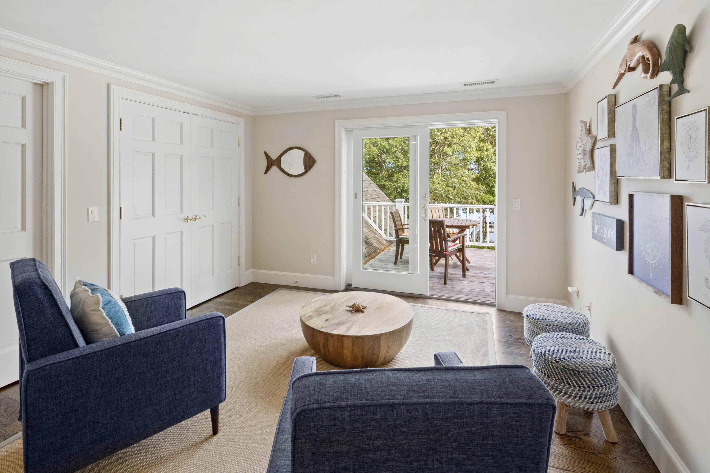 375 Baxter Neck Road Marstons Mills, MA 02648 - Photo 41 of 62 a living room with furniture and a large window