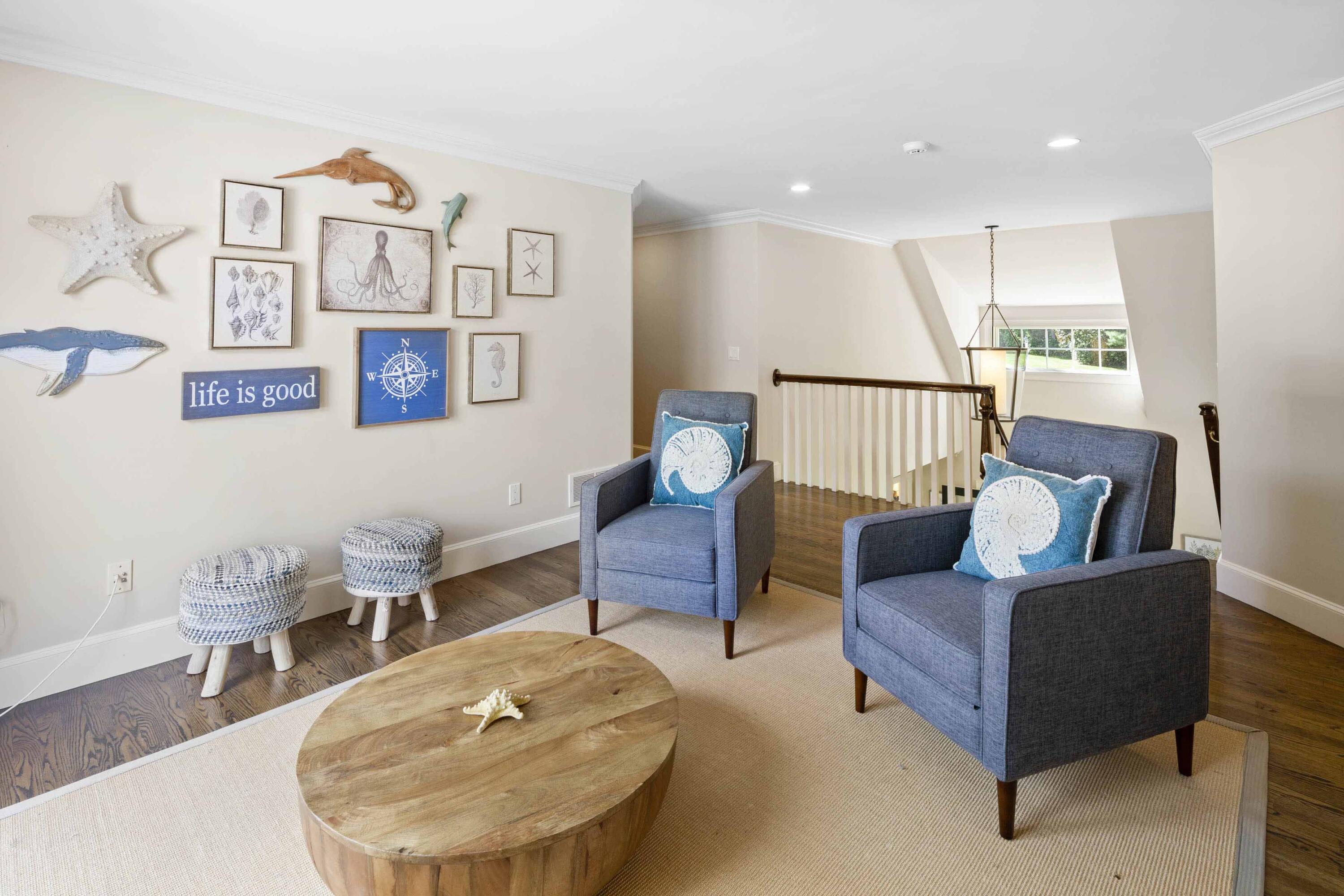 375 Baxter Neck Road Marstons Mills, MA 02648 - Photo 42 of 62 a living room with furniture and a table