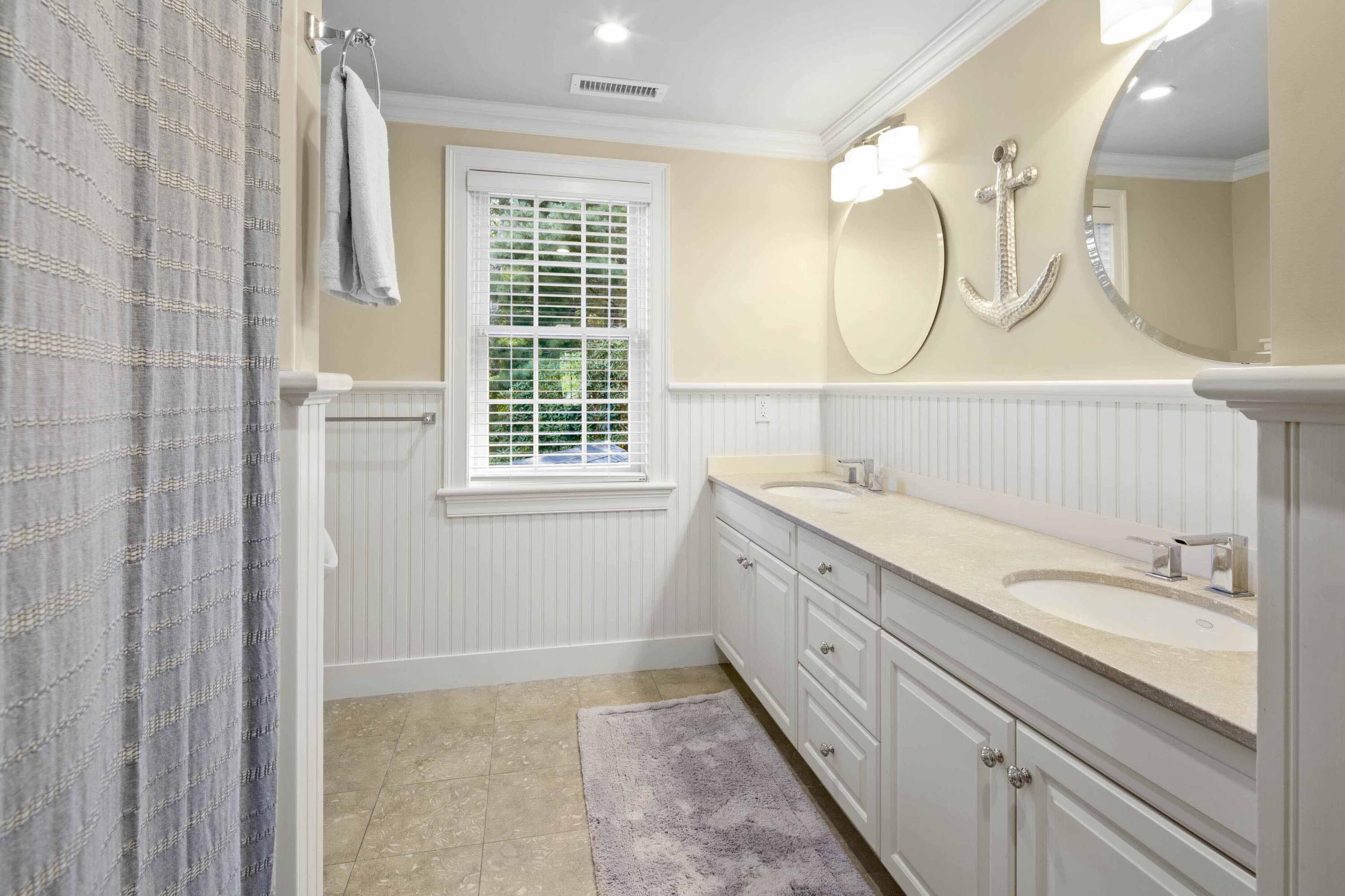375 Baxter Neck Road Marstons Mills, MA 02648 - Photo 54 of 62 a en suite bathroom with a granite countertop sink mirror and a shower