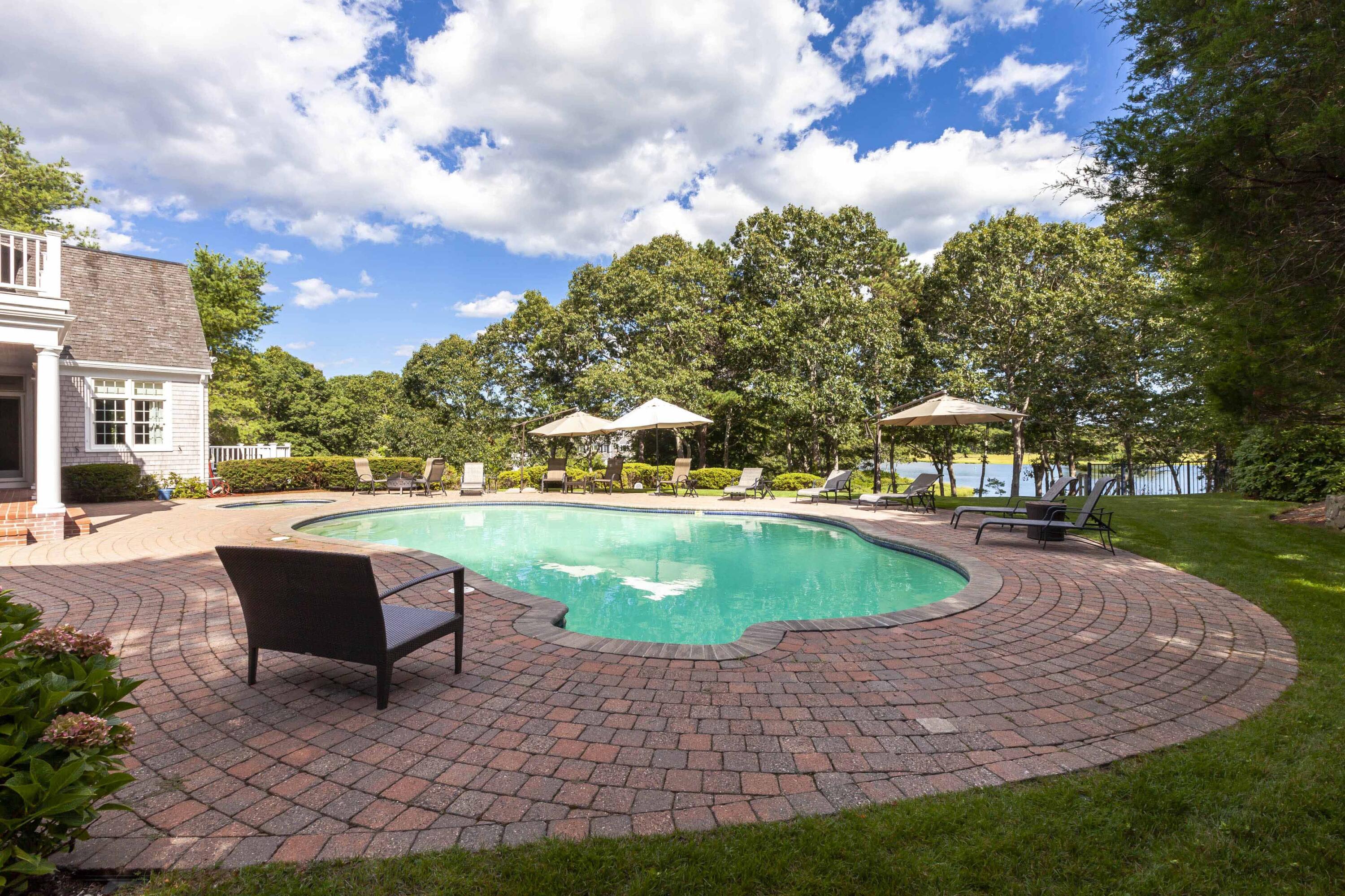 375 Baxter Neck Road Marstons Mills, MA 02648 - Photo 60 of 62 a swimming pool with outdoor seating and garden