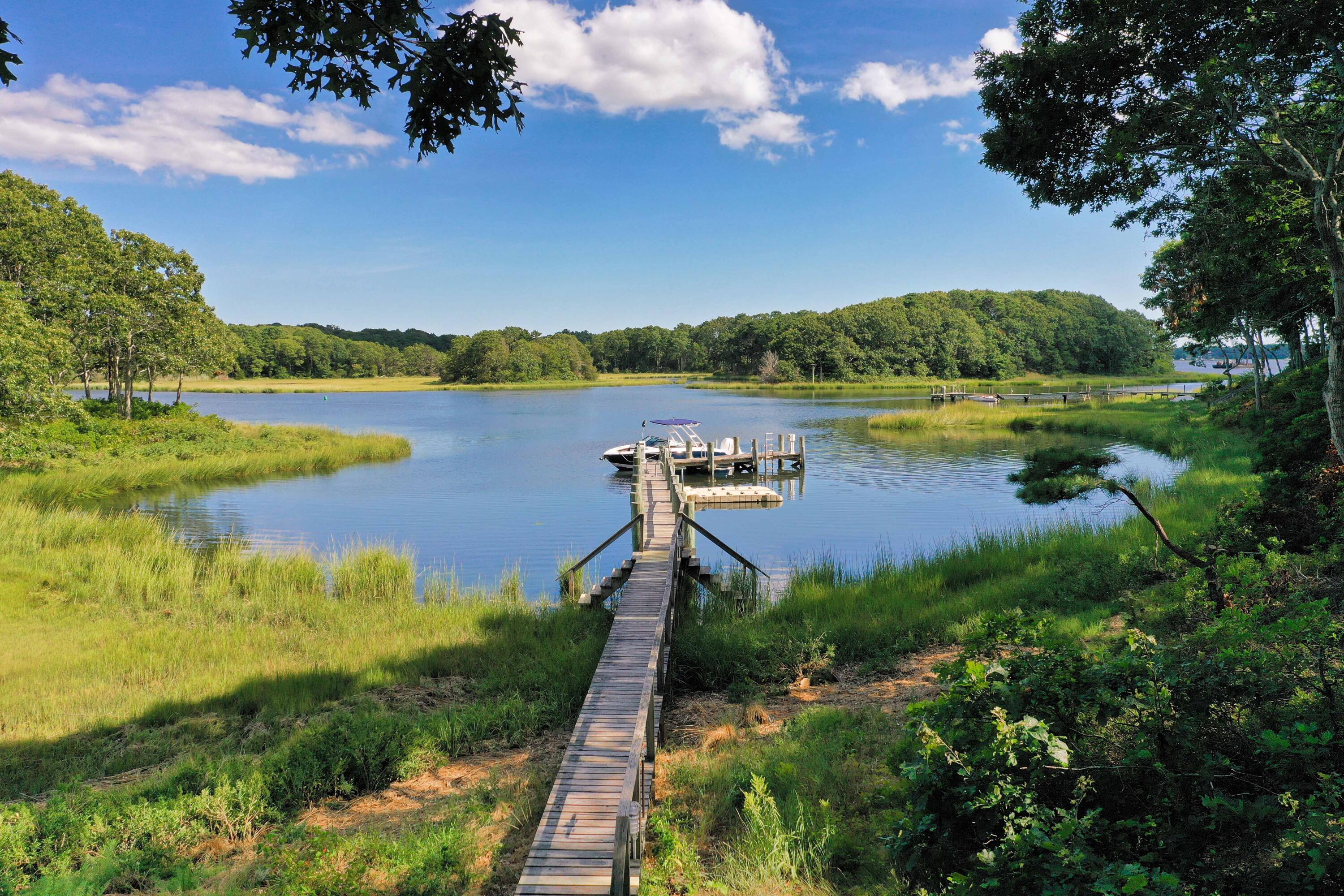 375 Baxter Neck Road Marstons Mills, MA 02648 - Photo 61 of 62 a view of a lake with a city view
