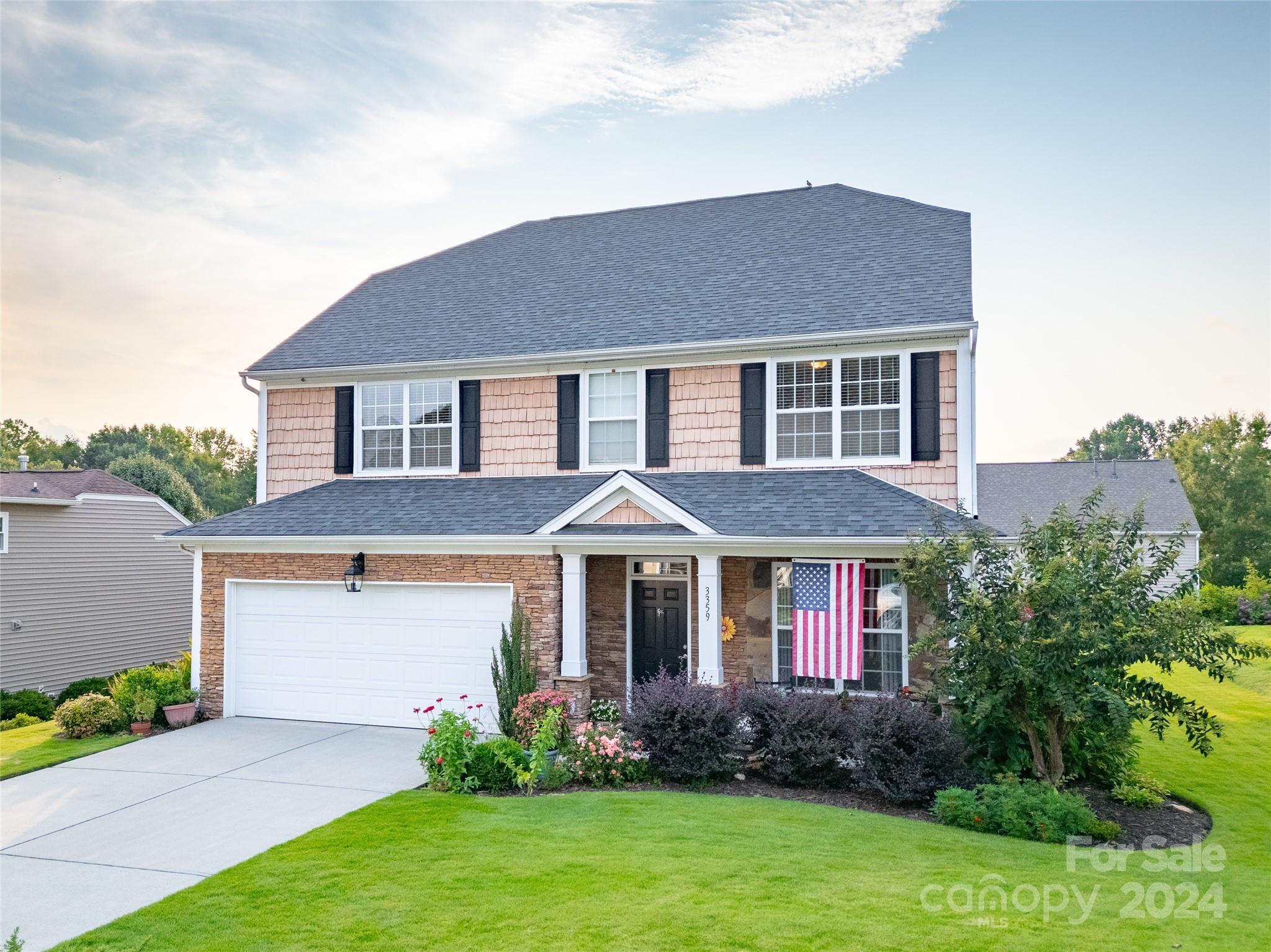 a front view of a house with garden
