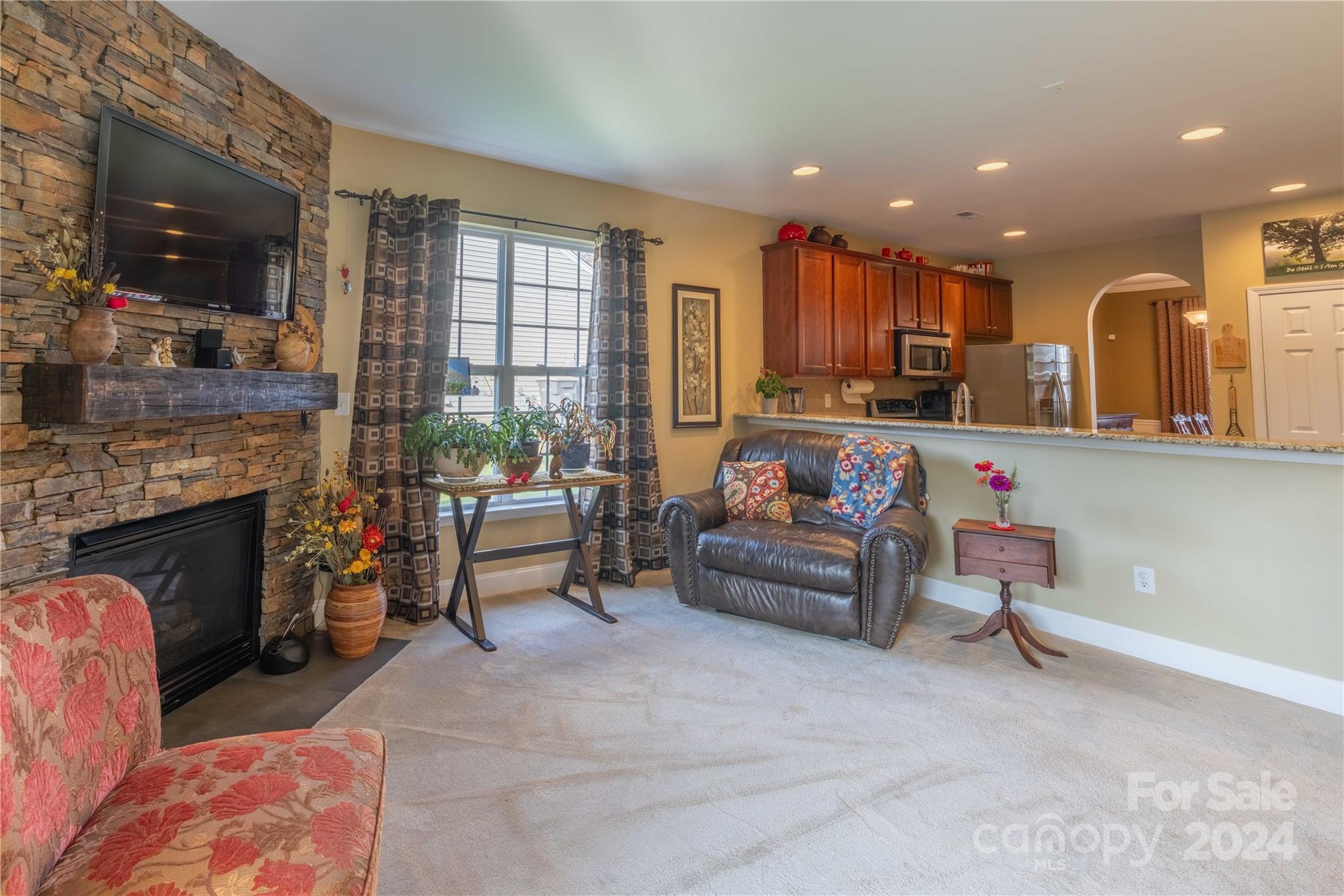 3359 Merchant Lane Davidson, NC 28036 - Photo 12 of 48 a living room with furniture and a fireplace