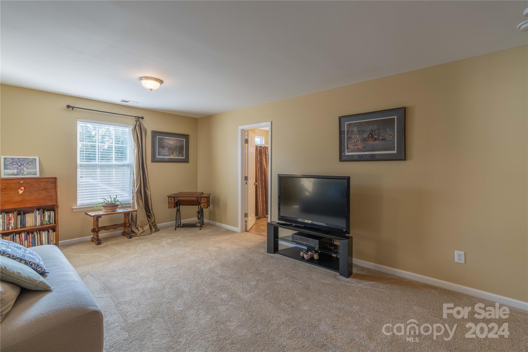 3359 Merchant Lane Davidson, NC 28036 - Photo 19 of 48 a living room with furniture and a flat screen tv