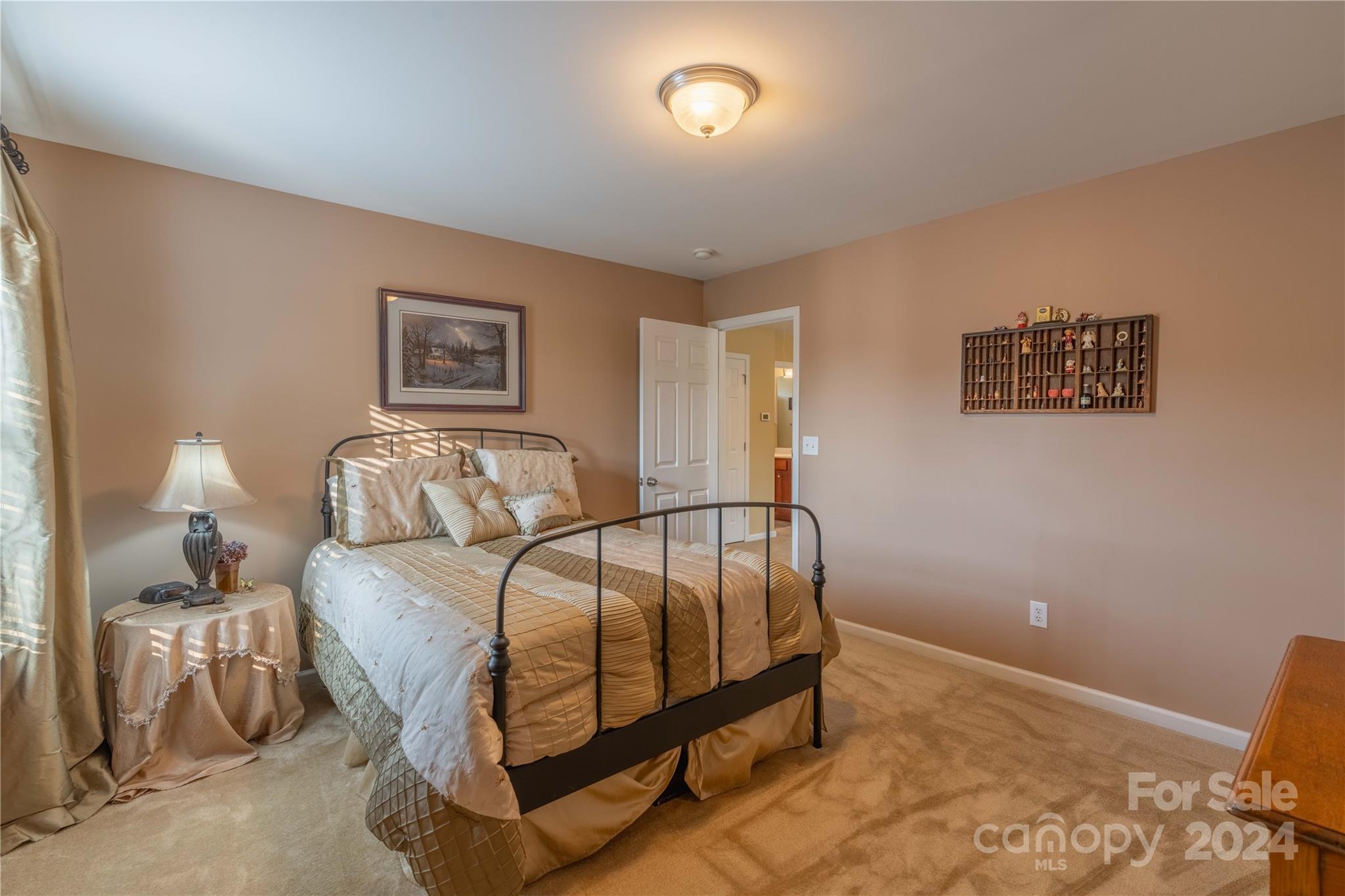3359 Merchant Lane Davidson, NC 28036 - Photo 22 of 48 a bedroom with a bed and a lamp with the wooden floor