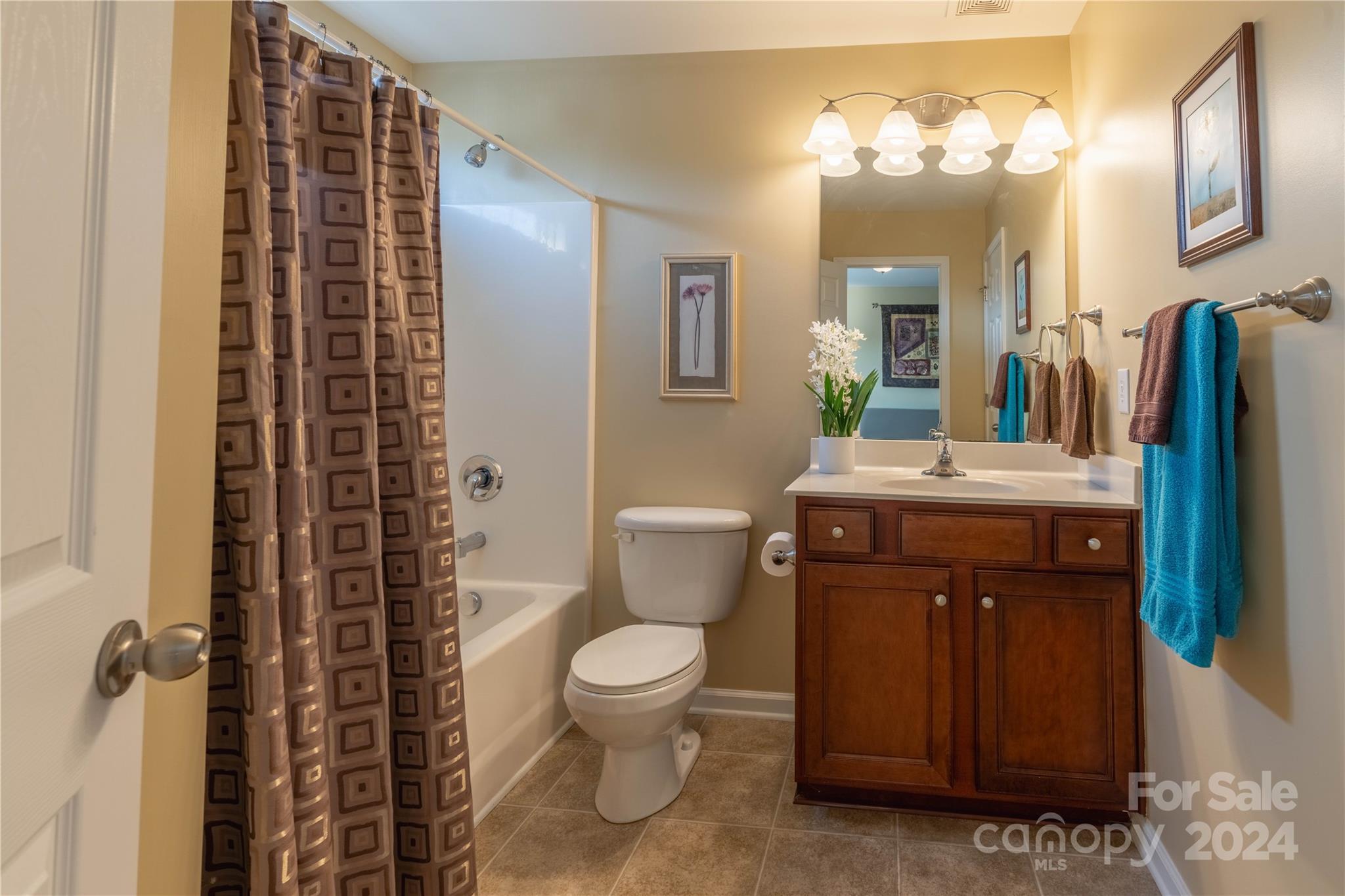 3359 Merchant Lane Davidson, NC 28036 - Photo 23 of 48 a bathroom with a sink a toilet and shower