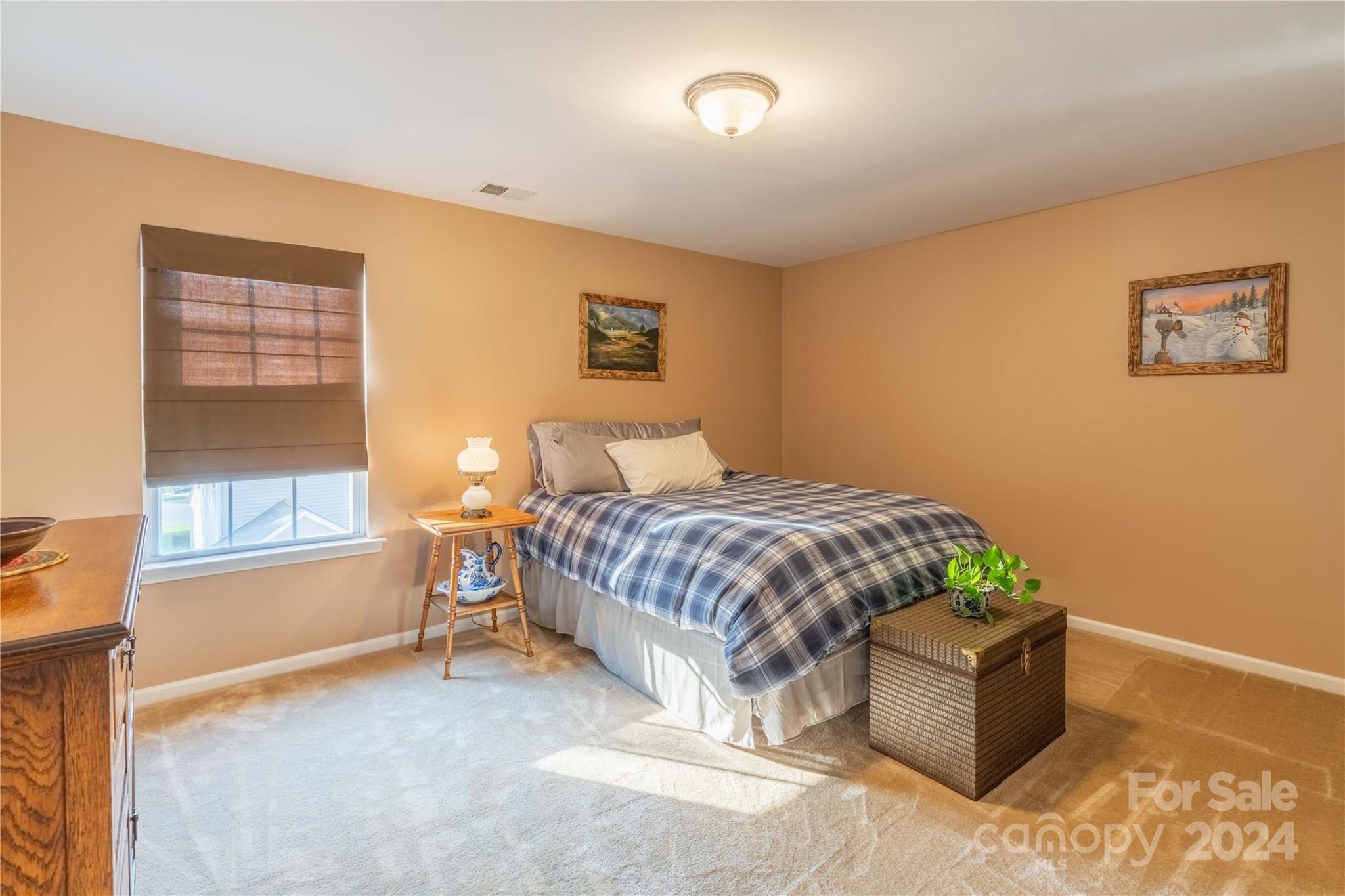 3359 Merchant Lane Davidson, NC 28036 - Photo 24 of 48 a bedroom with a bed and a window