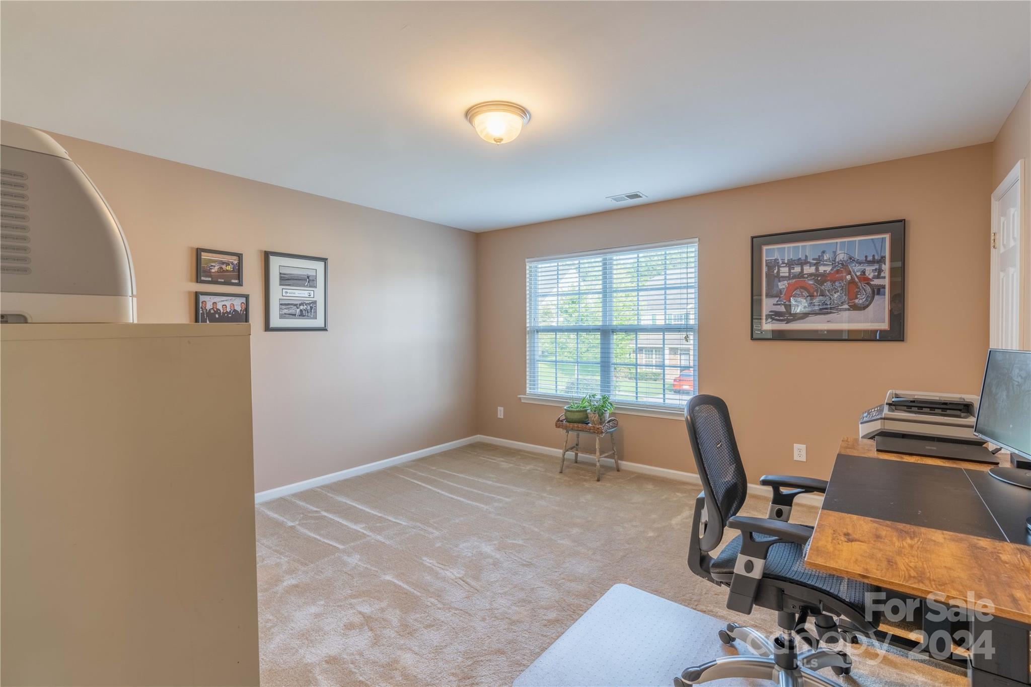3359 Merchant Lane Davidson, NC 28036 - Photo 27 of 48 a view of a workspace with furniture and a window