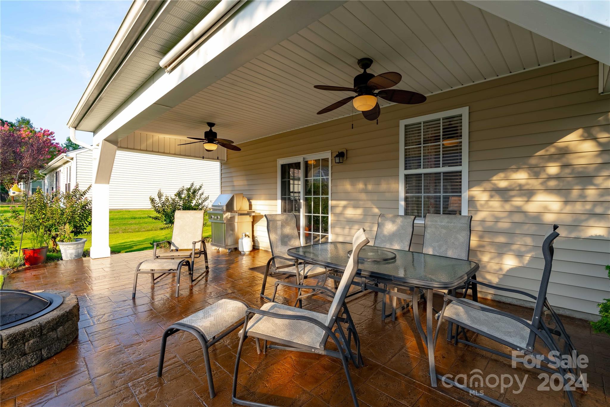 3359 Merchant Lane Davidson, NC 28036 - Photo 32 of 48 a view of a patio with couches table and chairs and potted plants