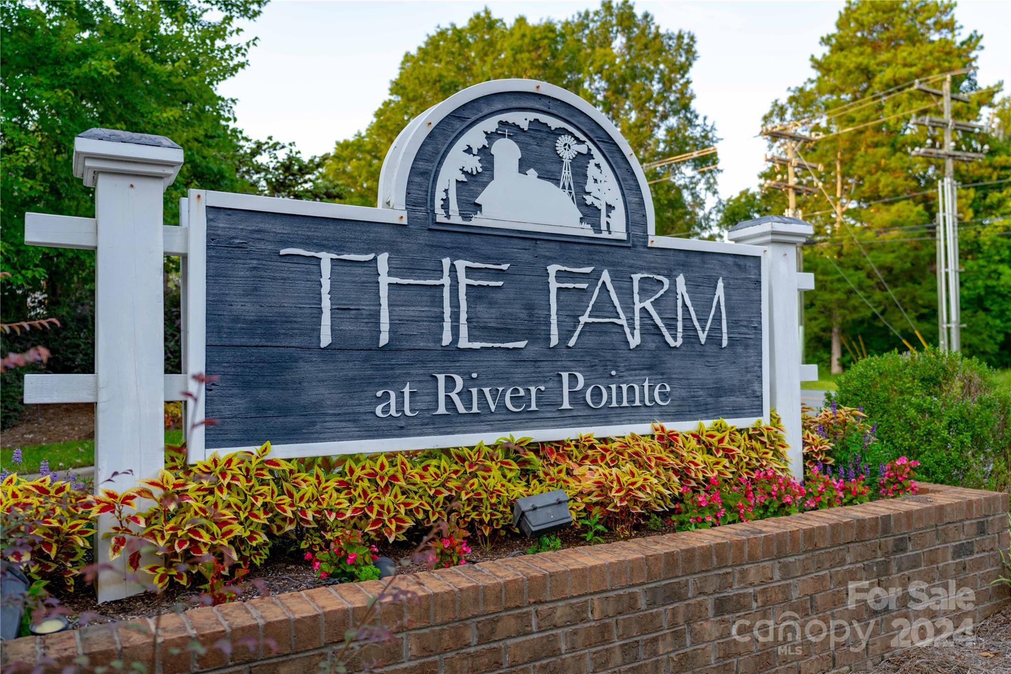 3359 Merchant Lane Davidson, NC 28036 - Photo 39 of 48 a wooden sign that is on the side of a building