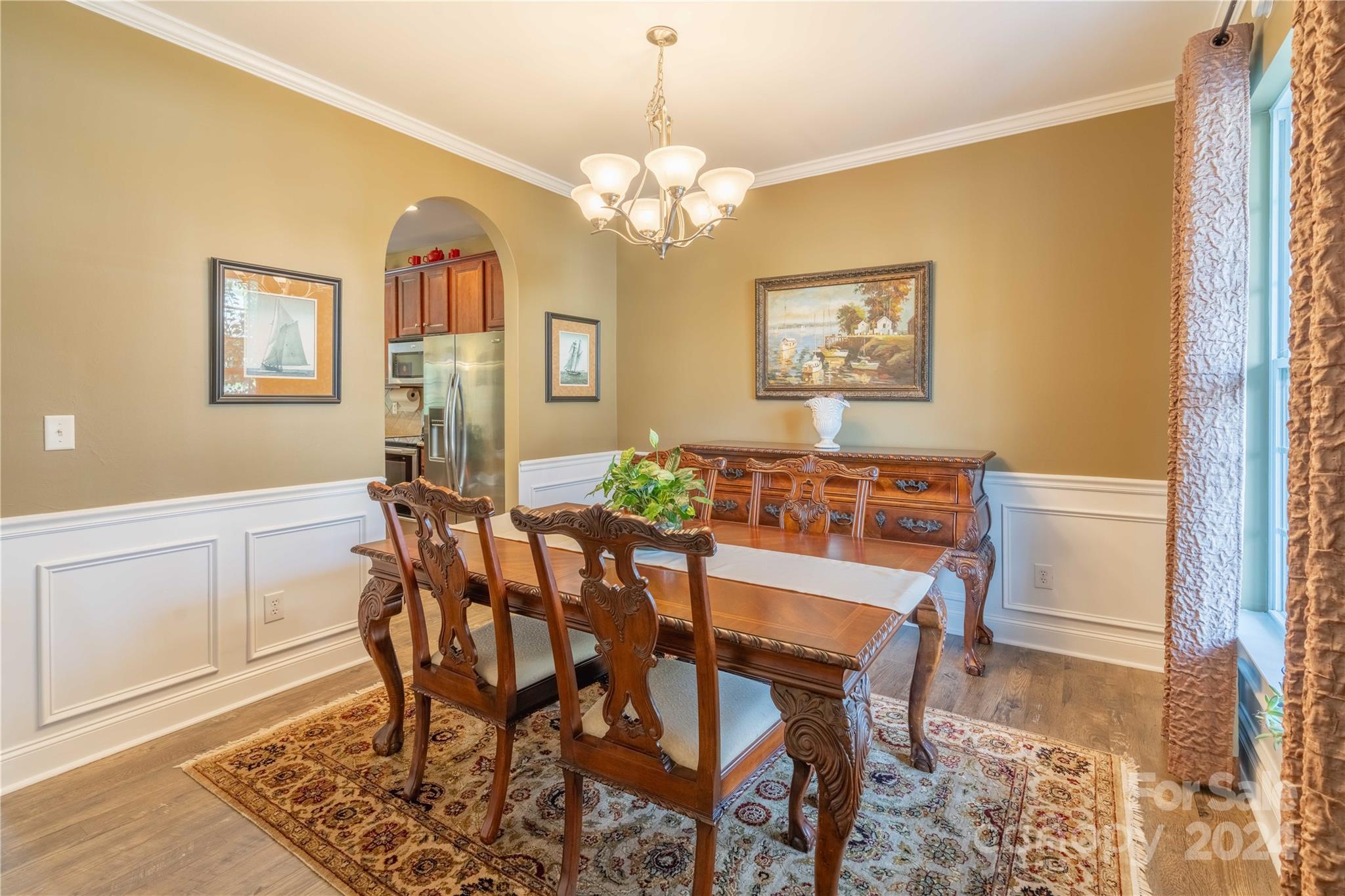3359 Merchant Lane Davidson, NC 28036 - Photo 4 of 48 a view of a dining room with furniture and chandelier