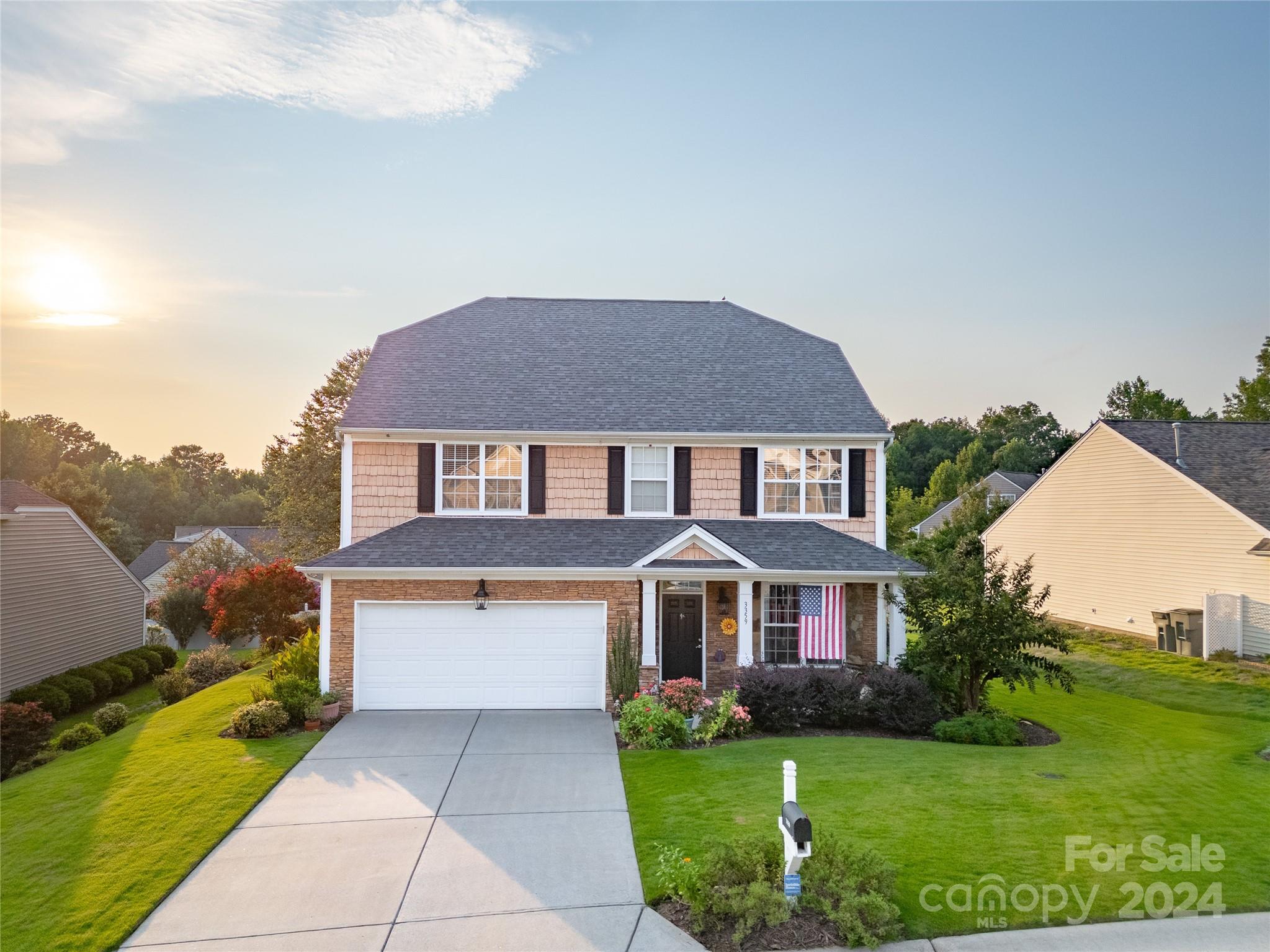 3359 Merchant Lane Davidson, NC 28036 - Photo 48 of 48 a front view of a house with garden