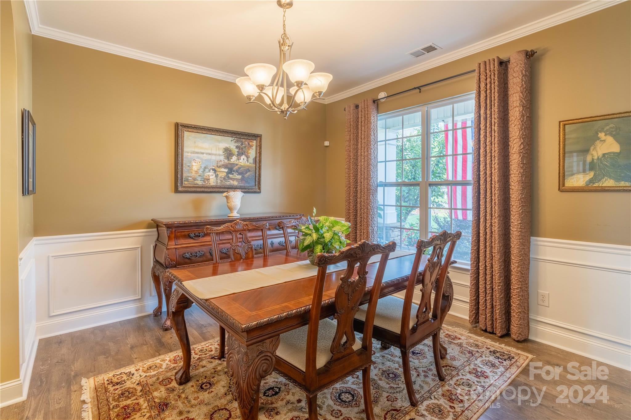 3359 Merchant Lane Davidson, NC 28036 - Photo 5 of 48 a view of a dining room with furniture and a chandelier
