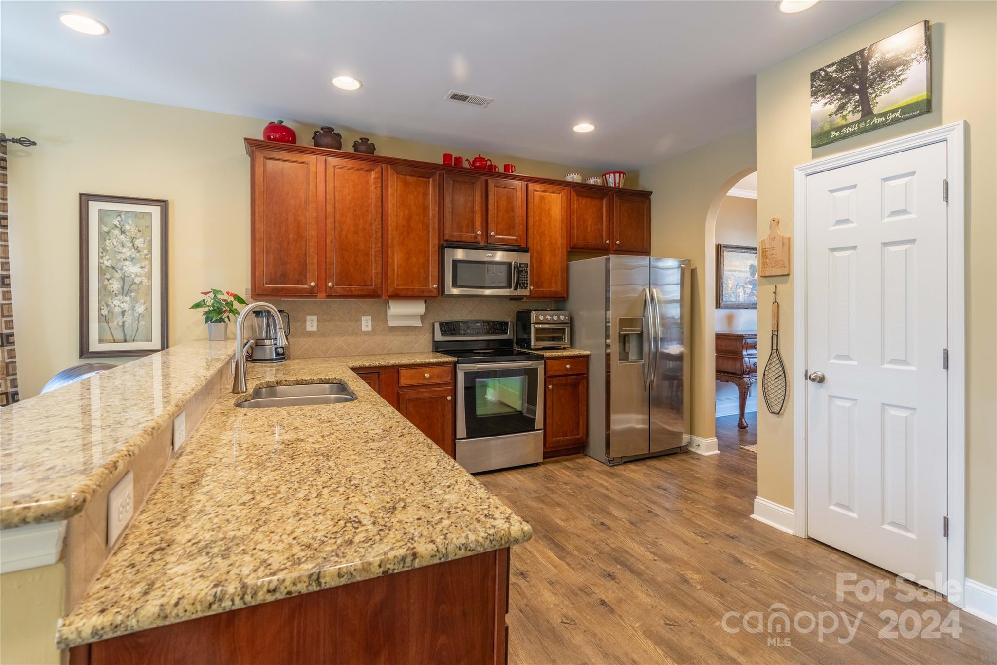 3359 Merchant Lane Davidson, NC 28036 - Photo 8 of 48 a kitchen with stainless steel appliances granite countertop a refrigerator stove and oven