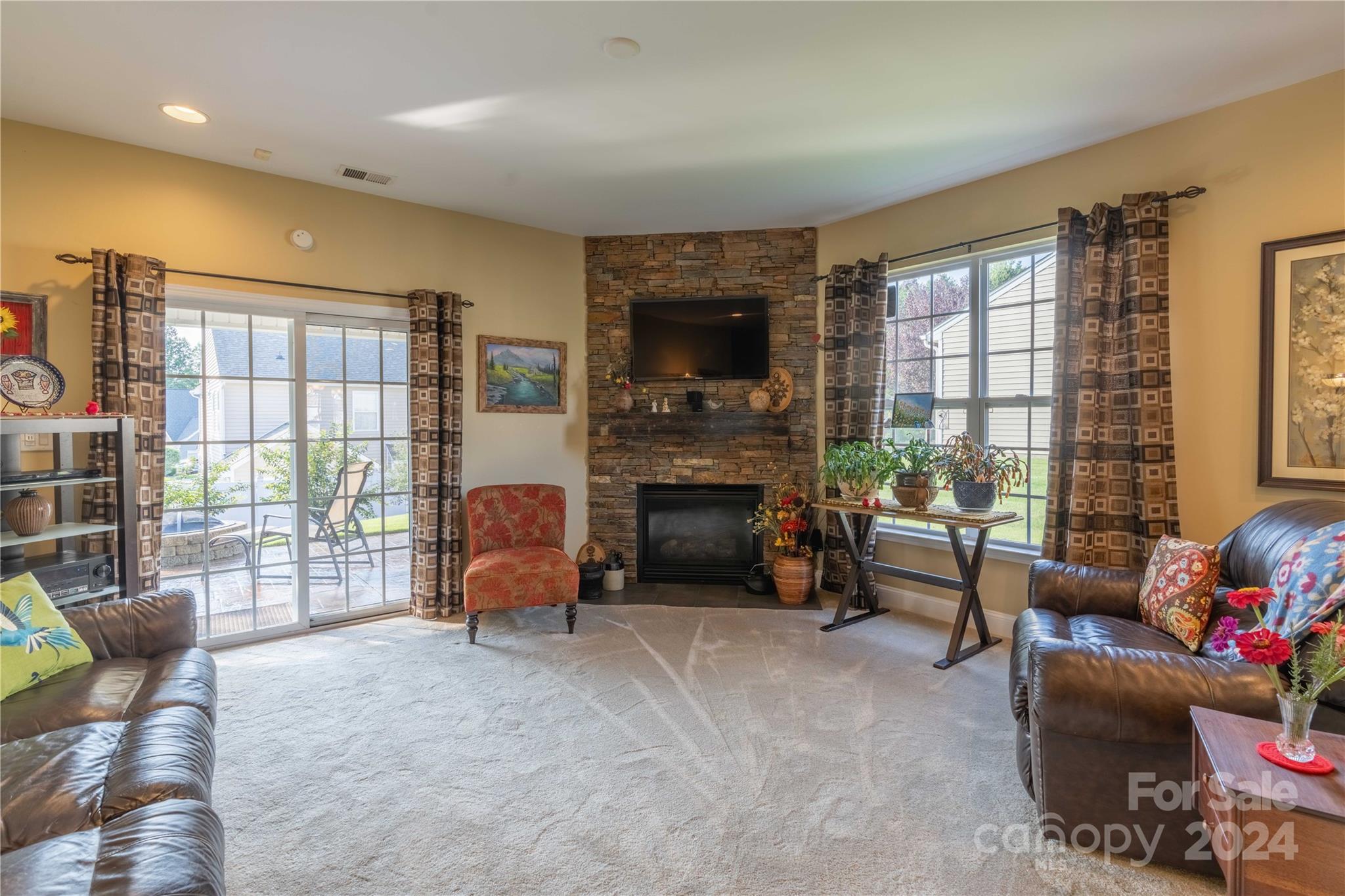 3359 Merchant Lane Davidson, NC 28036 - Photo 9 of 48 a living room with furniture and a flat screen tv