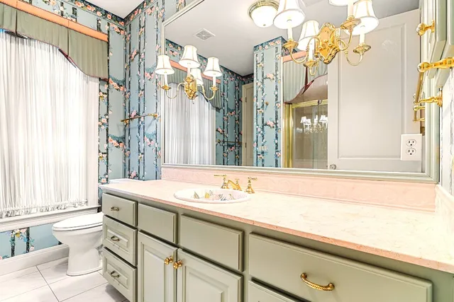 a spacious bathroom with a granite countertop shower and a sink