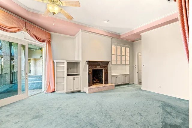 a bathroom with a sink and a large mirror next to a window