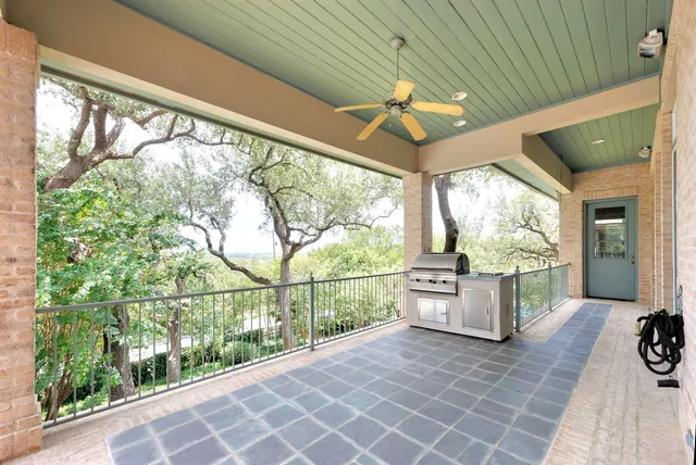 a view of a room with wooden floor and windows