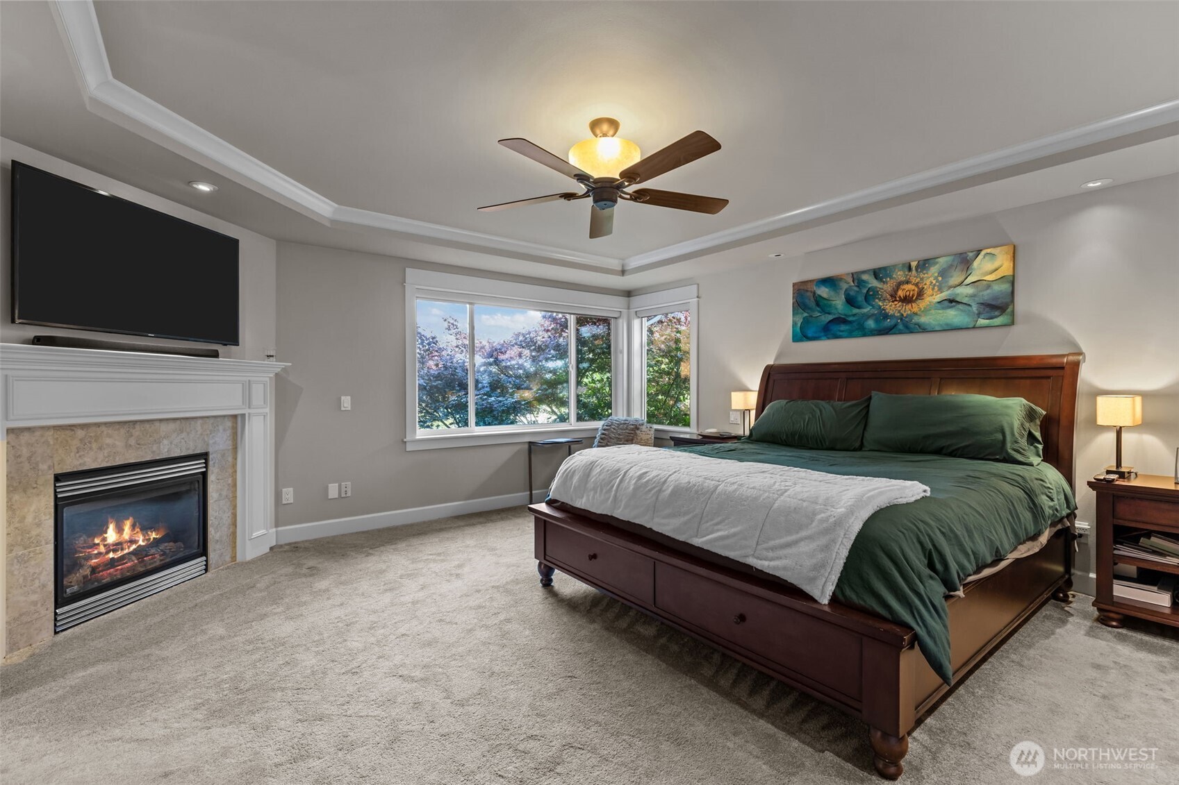 8614 Northeast 198th Street Bothell, WA 98011 - Photo 16 of 40 a spacious bedroom with a bed and a fireplace