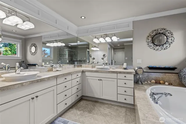 a bathroom with a bathtub and shower
