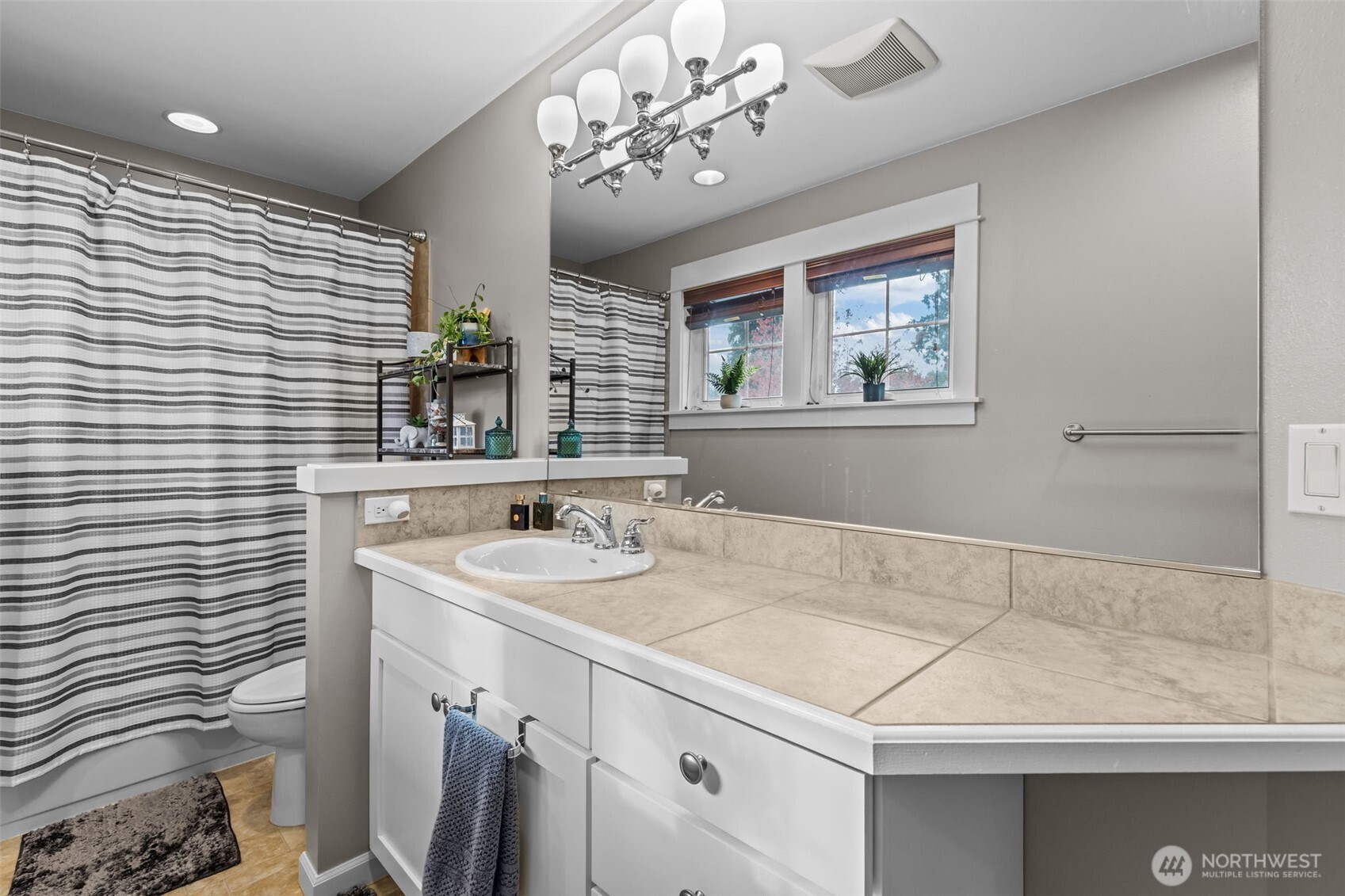 8614 Northeast 198th Street Bothell, WA 98011 - Photo 23 of 40 a bathroom with a sink and a mirror