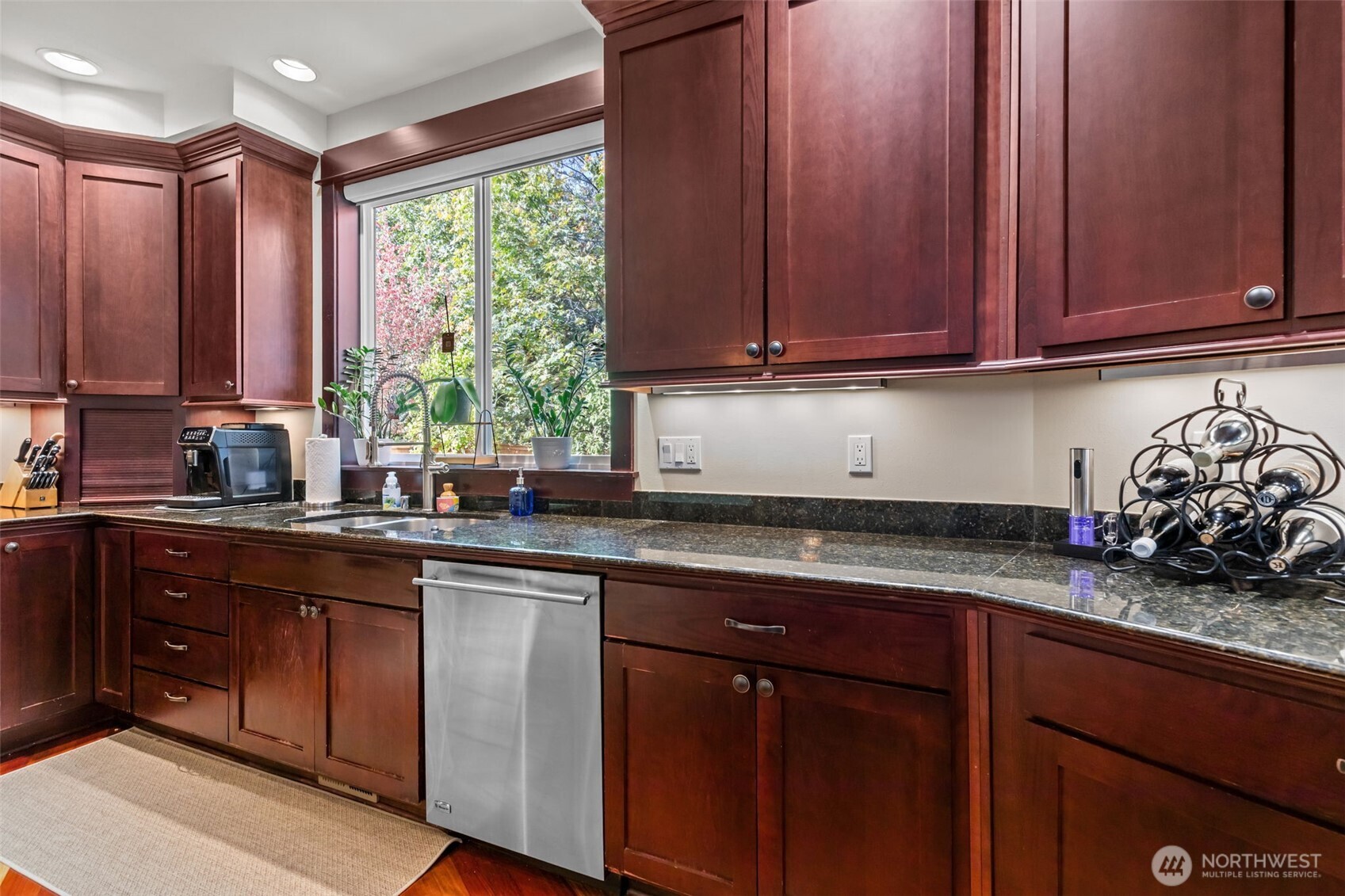 8614 Northeast 198th Street Bothell, WA 98011 - Photo 7 of 40 a kitchen with stainless steel appliances granite countertop wooden cabinets a sink and dishwasher
