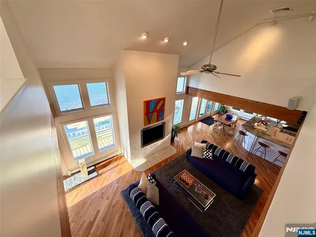 a living room with furniture fireplace and flat screen tv